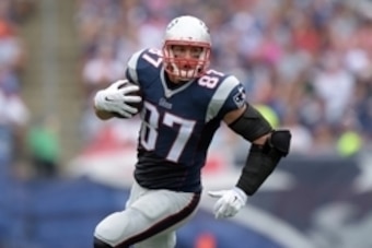 Sep 21, 2014; Foxborough, MA, USA; New England Patriots tight end Rob Gronkowski (87) carries the ball against the Oakland Raiders at Gillette Stadium. Mandatory Credit: Kirby Lee-USA TODAY Sports
