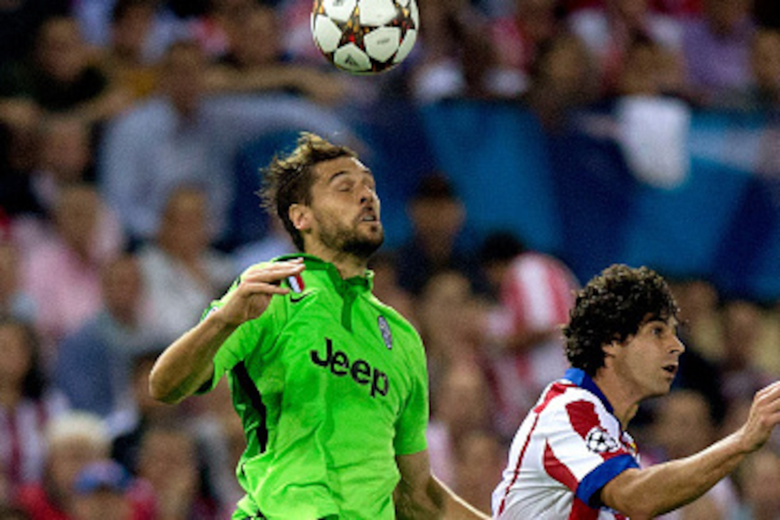 MADRID, SPAIN - OCTOBER 01: Fernando Llorente of Juventus wins the header after Tiago Mendes of Atletico de Madrid during the UEFA Champions League group A match between Club Atletico de Madrid and Juventus at Vievnte Calderon Stadium on October 1, 2014 i MADRID, SPAIN - OCTOBER 01: Fernando Llorente of Juventus wins the header after Tiago Mendes of Atletico de Madrid during the UEFA Champions League group A match between Club Atletico de Madrid and Juventus at Vievnte Calderon Stadium on October 1, 2014 i