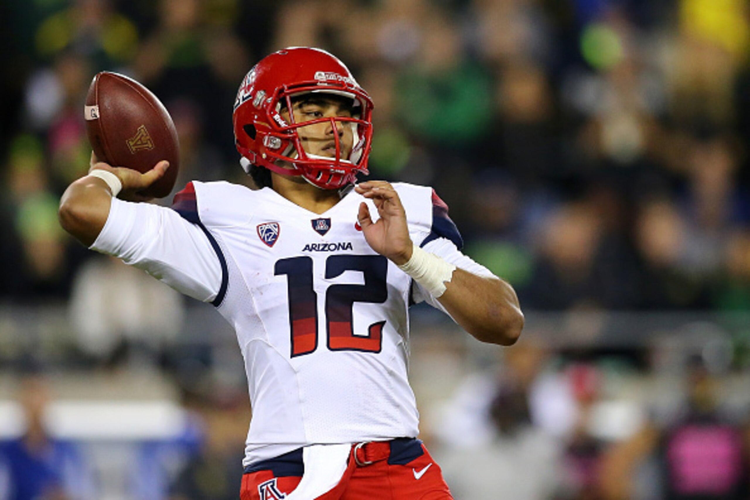 EUGENE, OR - OCTOBER 02: Anu Solomon #12 of the Arizona Wildcats throws a pass against the Oregon Ducks at Autzen Stadium on October 2, 2014 in Eugene, Oregon. (Photo by Jonathan Ferrey/Getty Images) EUGENE, OR - OCTOBER 02: Anu Solomon #12 of the Arizona Wildcats throws a pass against the Oregon Ducks at Autzen Stadium on October 2, 2014 in Eugene, Oregon. (Photo by Jonathan Ferrey/Getty Images)