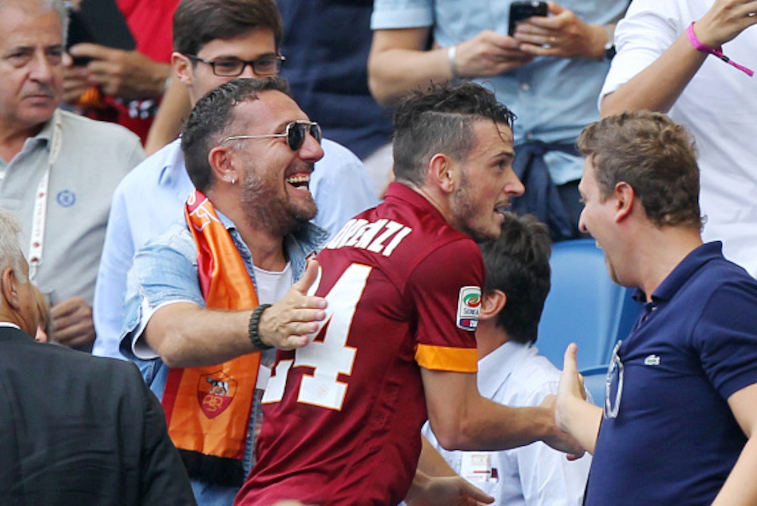 ROME, ITALY - SEPTEMBER 21:  Alessandro Florenzi of AS Roma celebrates with his fans on the stands after scoring the second team's goal during the Serie A match between AS Roma and Cagliari Calcio at Stadio Olimpico on September 21, 2014 in Rome, Italy.  
