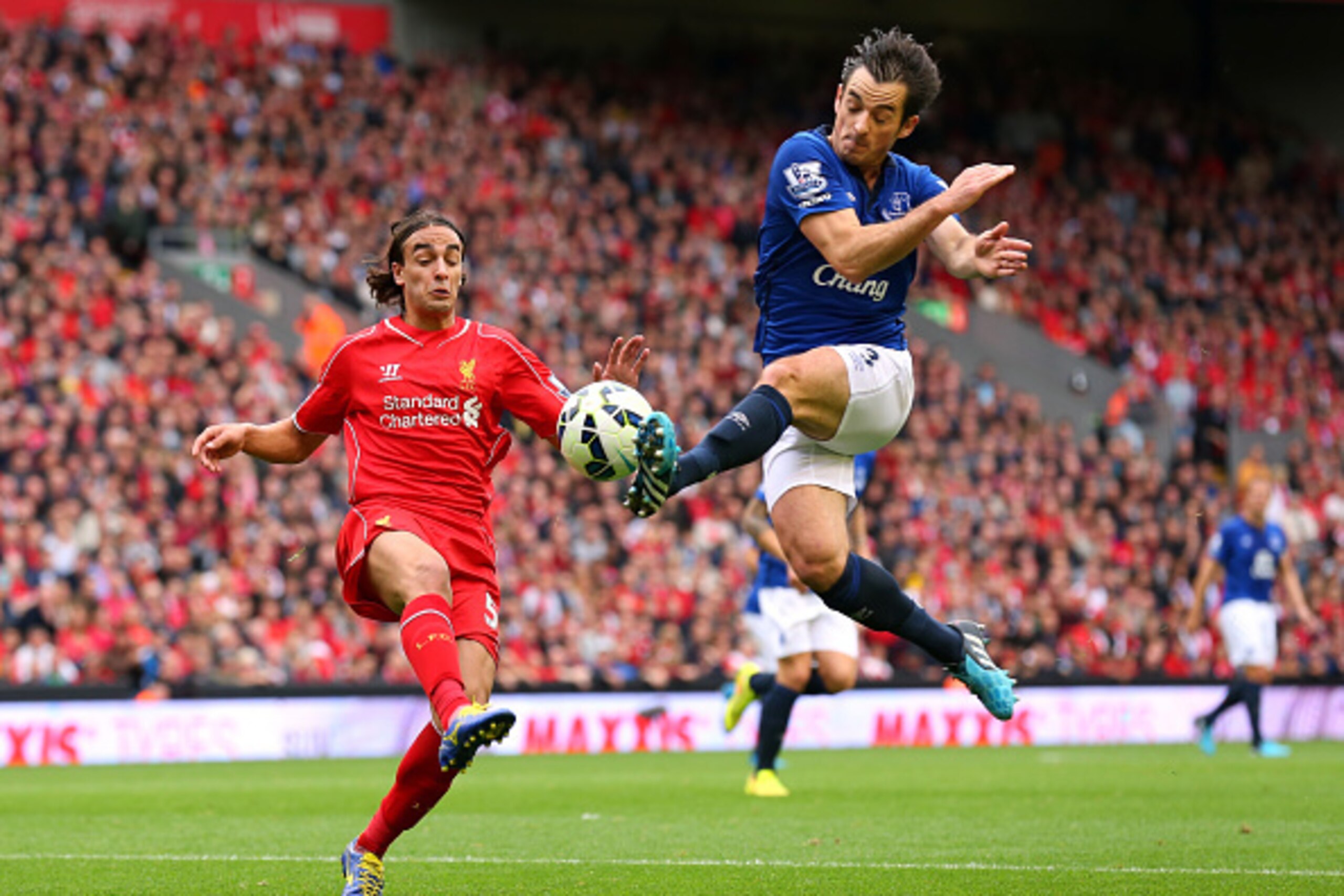 LIVERPOOL, ENGLAND - SEPTEMBER 27:  Leighton Baines of Everton tackles Lazar Markovic of Liverpool during the Barclays Premier League match between Liverpool and Everton at Anfield on September 27, 2014 in Liverpool, England.  (Photo by Alex Livesey/Getty