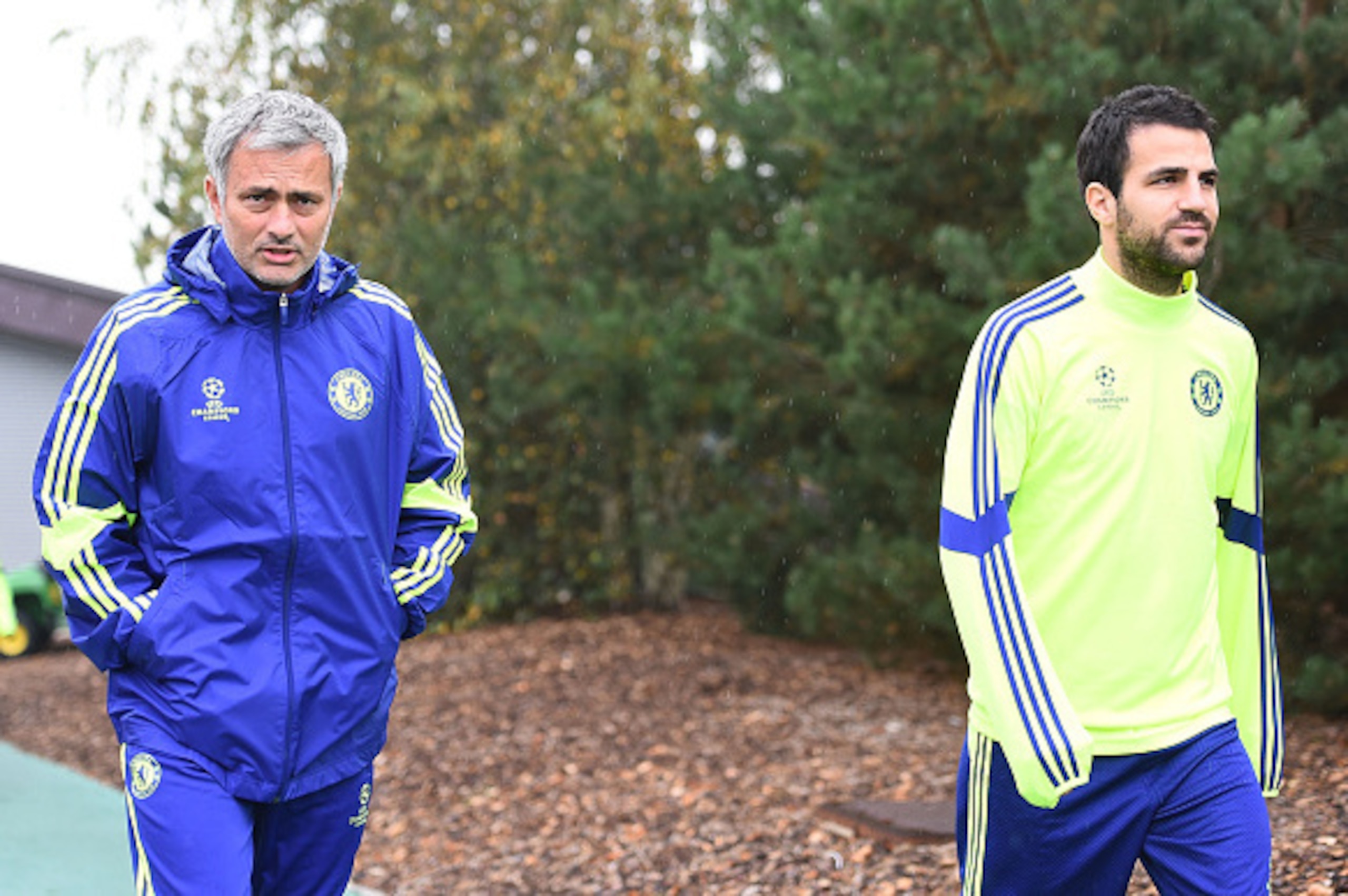 COBHAM, ENGLAND - SEPTEMBER 29:  Manager Jose Mourinho and Cesc Fabregas walks out onto the training pitch during the Chelsea Training Session at Chelsea Training Ground on September 29, 2014 in Cobham, England.  (Photo by Christopher Lee/Getty Images)