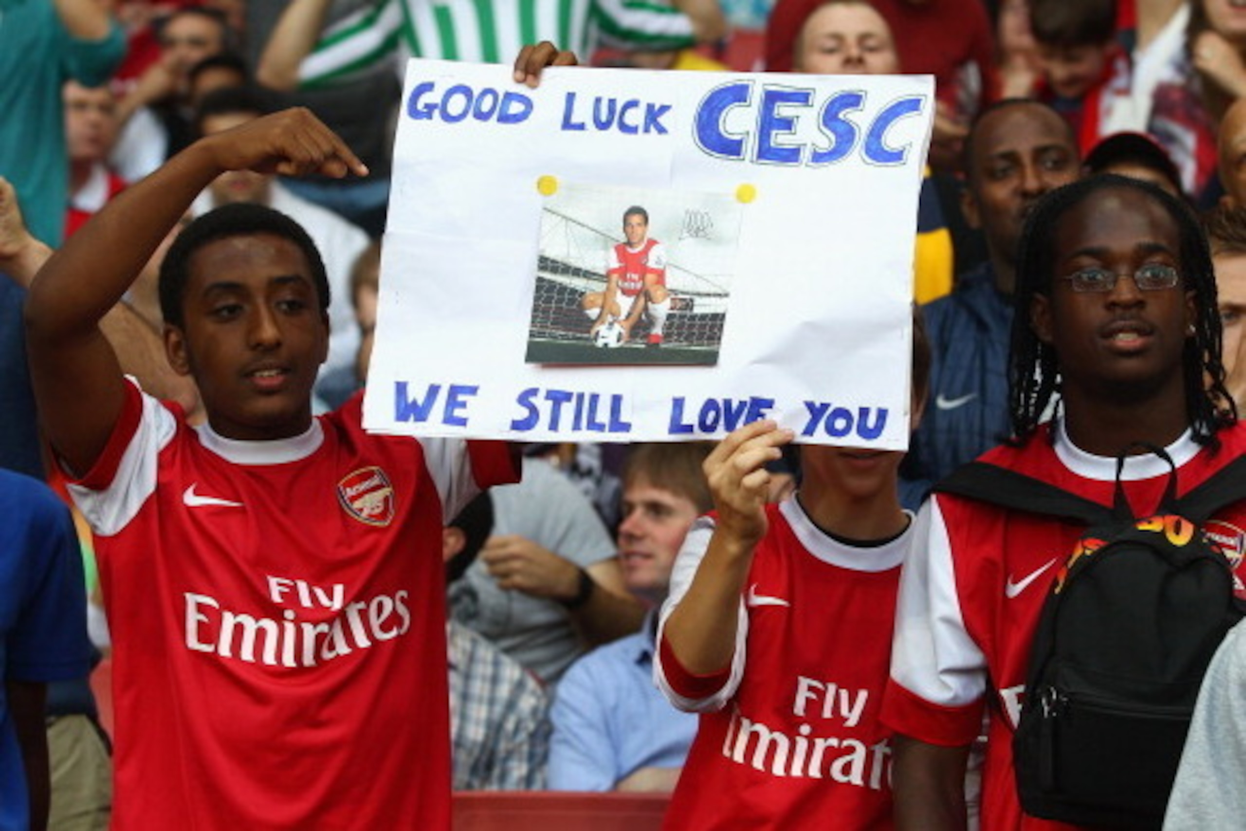LONDON, ENGLAND - AUGUST 16:  Arsenal fans show their support for former captain Cesc Fabregas ahead of the UEFA Champions League play-off first leg match between Arsenal and Udinese at the Emirates Stadium on August 16, 2011 in London, England.  (Photo b