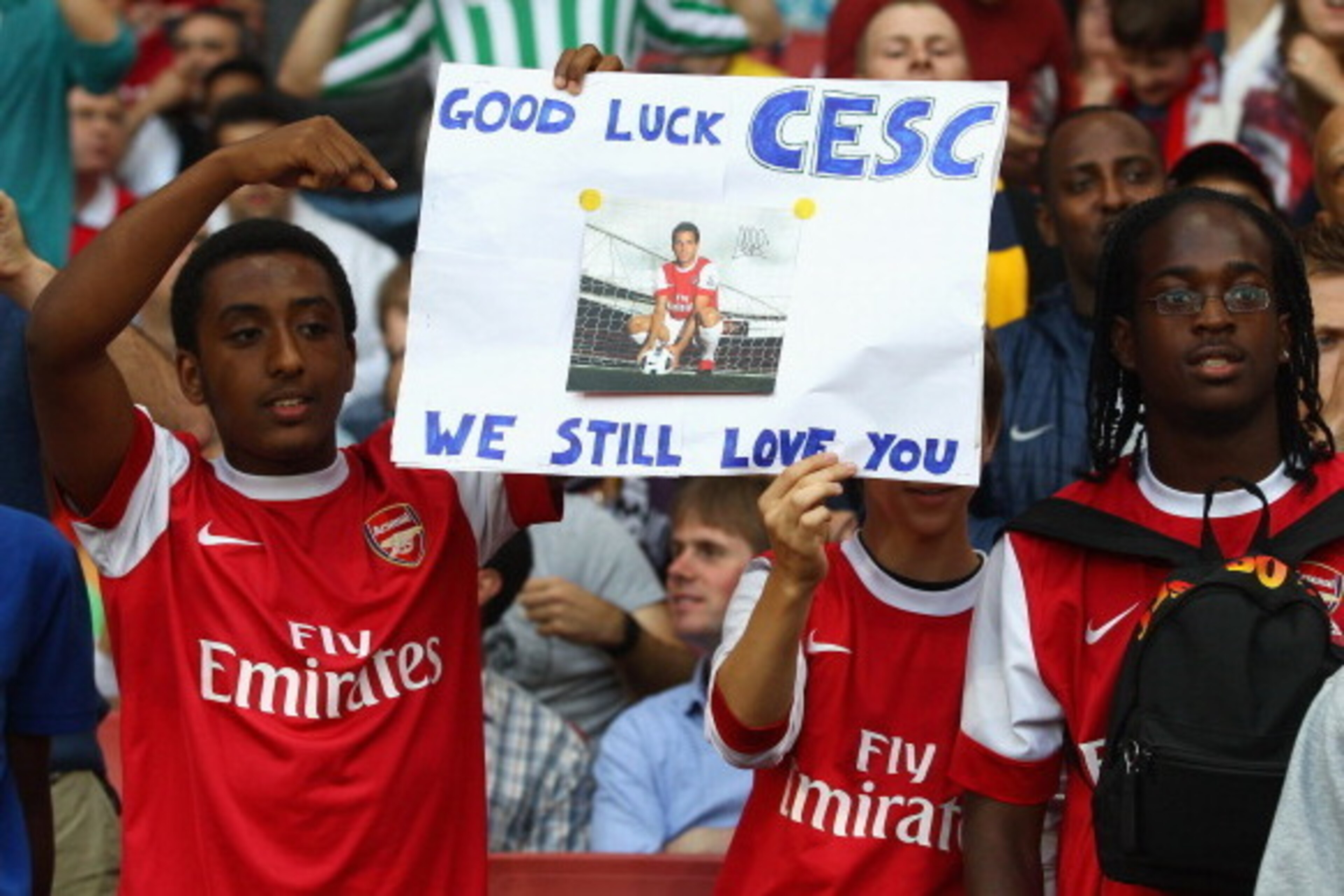 LONDON, ENGLAND - AUGUST 16:  Arsenal fans show their support for former captain Cesc Fabregas ahead of the UEFA Champions League play-off first leg match between Arsenal and Udinese at the Emirates Stadium on August 16, 2011 in London, England.  (Photo b