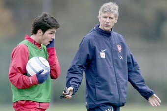 LONDON - NOVEMBER 1: Manager Arsene Wenger of Arsenal talks to Cesc Fabregas during the Arsenal Football Club training session at London Colney training ground on November 1, 2004 in London. (Photo by Paul Gilham/Getty Images)