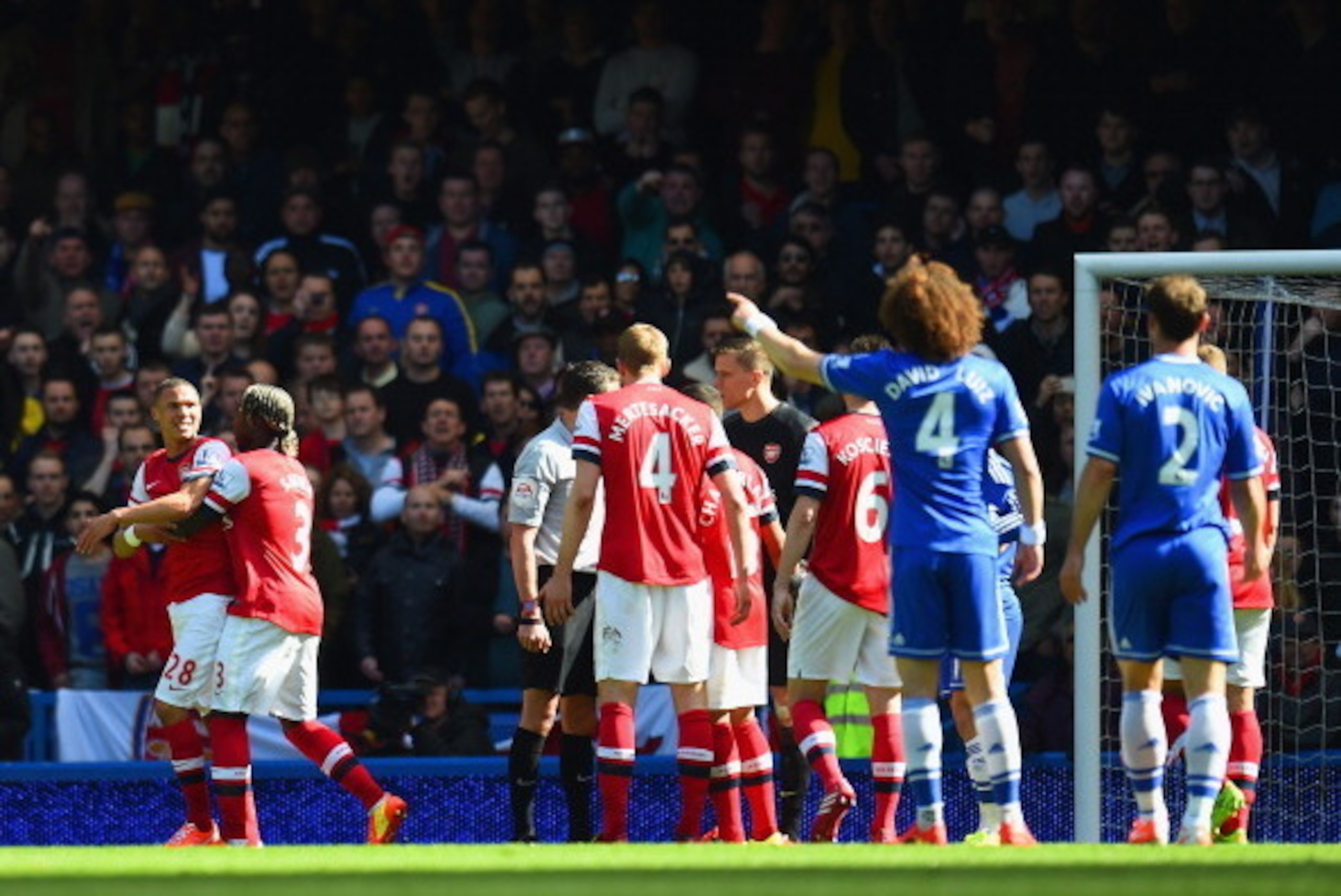 LONDON, ENGLAND - MARCH 22:  Kieran Gibbs of Arsenal reacts after being shown a straight red as Alex Oxlade-Chamberlain of Arsenal appeals to Referee Andre Marriner during the Barclays Premier League match between Chelsea and Arsenal at Stamford Bridge on