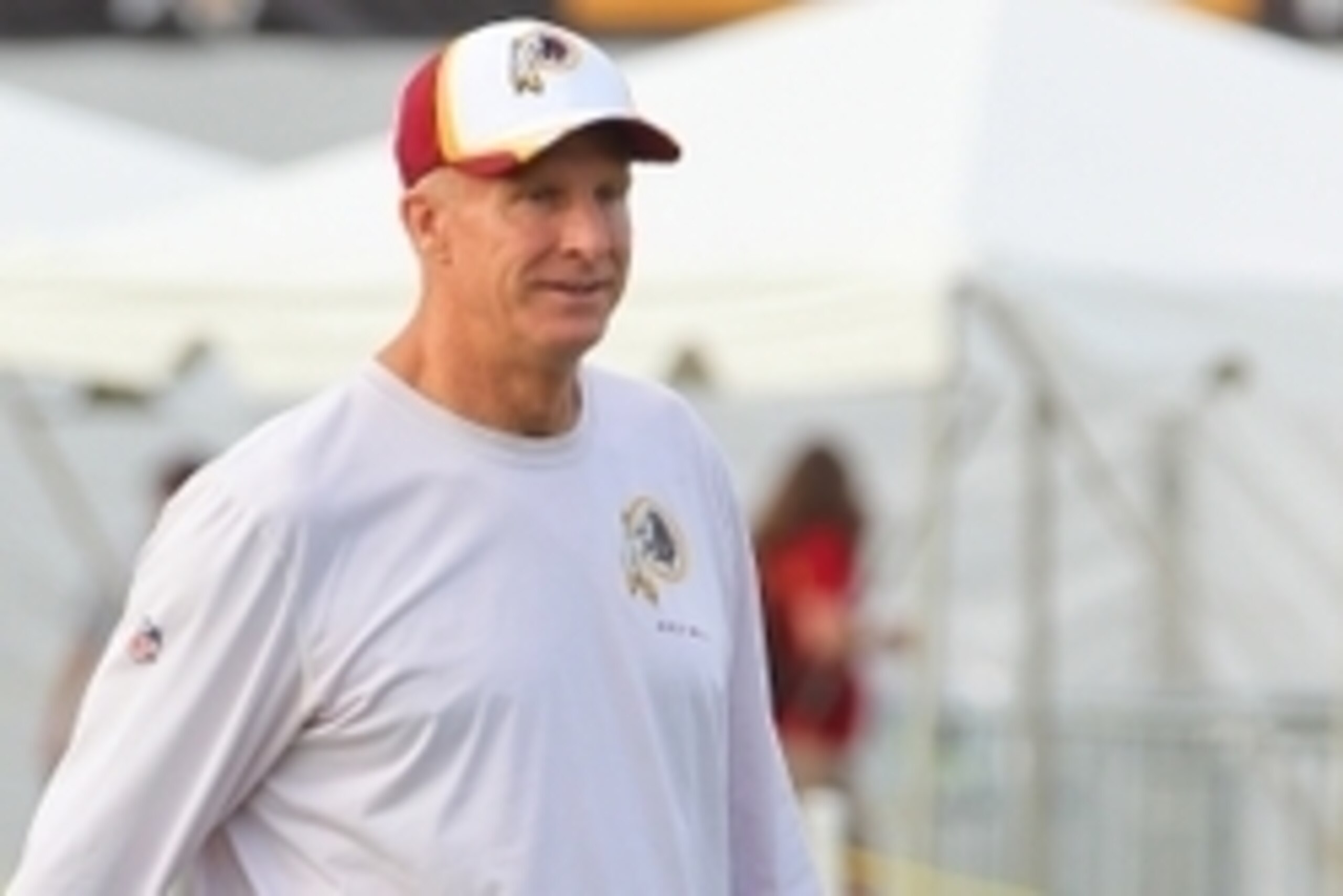 Jul 25, 2014; Richmond, VA, USA; Washington Redskins defensive coordinator Jim Haslett walks onto the field prior to practice on day three of training camp at Bon Secours Washington Redskins Training Center. Mandatory Credit: Geoff Burke-USA TODAY Sports