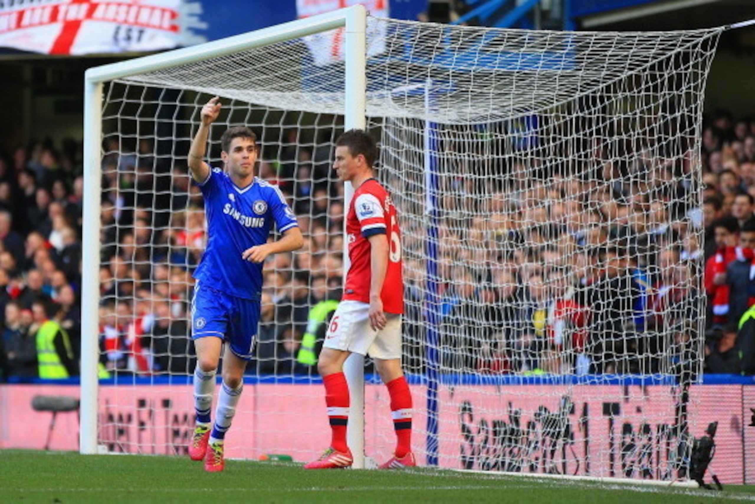 LONDON, ENGLAND - MARCH 22:  Oscar of Chelsea celebrates scoring their fourth goal during the Barclays Premier League match between Chelsea and Arsenal at Stamford Bridge on March 22, 2014 in London, England.  (Photo by Richard Heathcote/Getty Images)