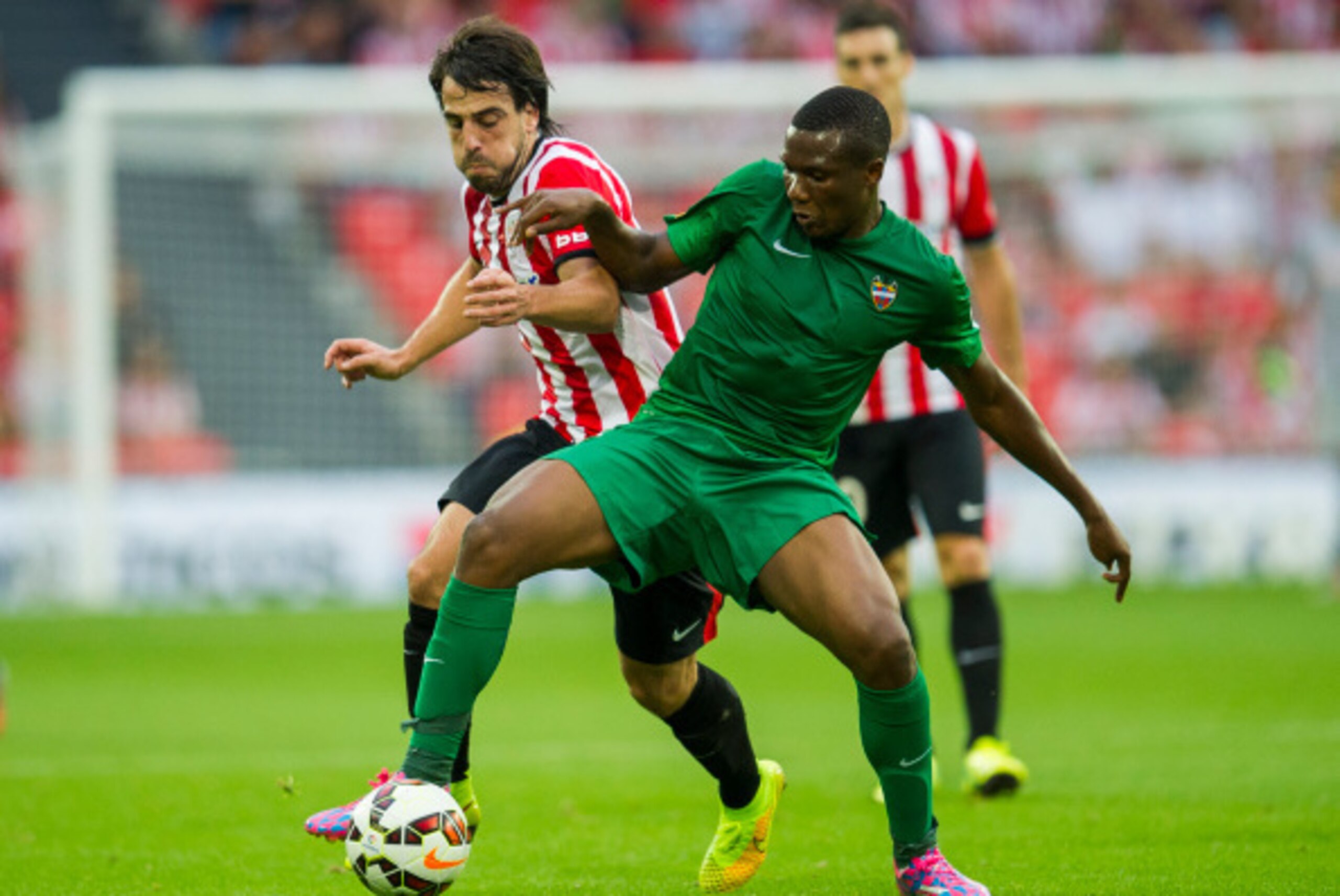 BILBAO, SPAIN - AUGUST 30:  Benat Etxebarria of Athletic Club Bilbao duels for the ball with Simao Mate of Levante UD the La Liga match between Athletic Club and Levante UD at San Mames Stadium on August 30, 2014 in Bilbao, Spain.  (Photo by Juan Manuel S