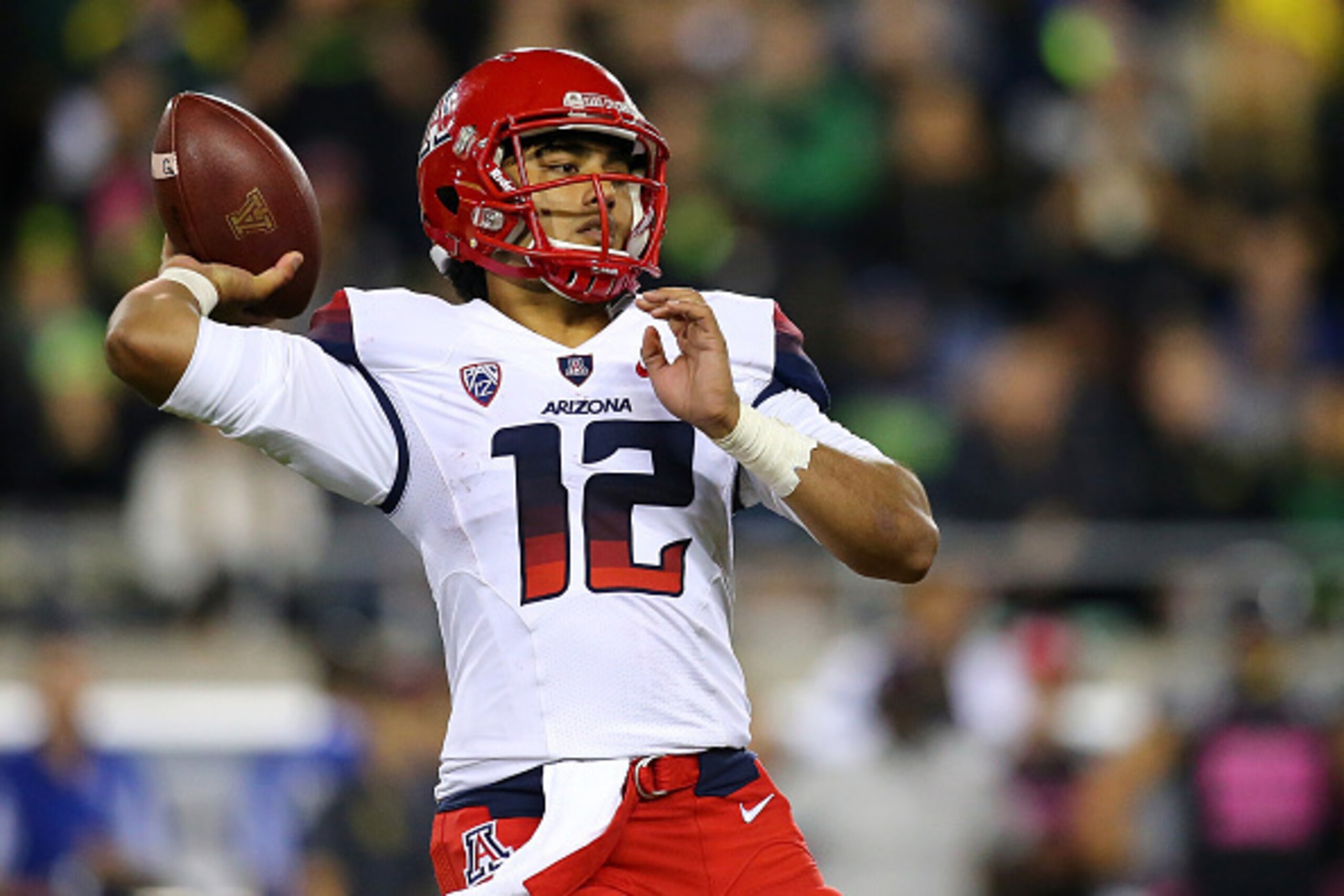 EUGENE, OR - OCTOBER 02:  Anu Solomon #12 of the Arizona Wildcats throws a pass against  the Oregon Ducks at Autzen Stadium on October 2, 2014  in Eugene, Oregon.  (Photo by Jonathan Ferrey/Getty Images)