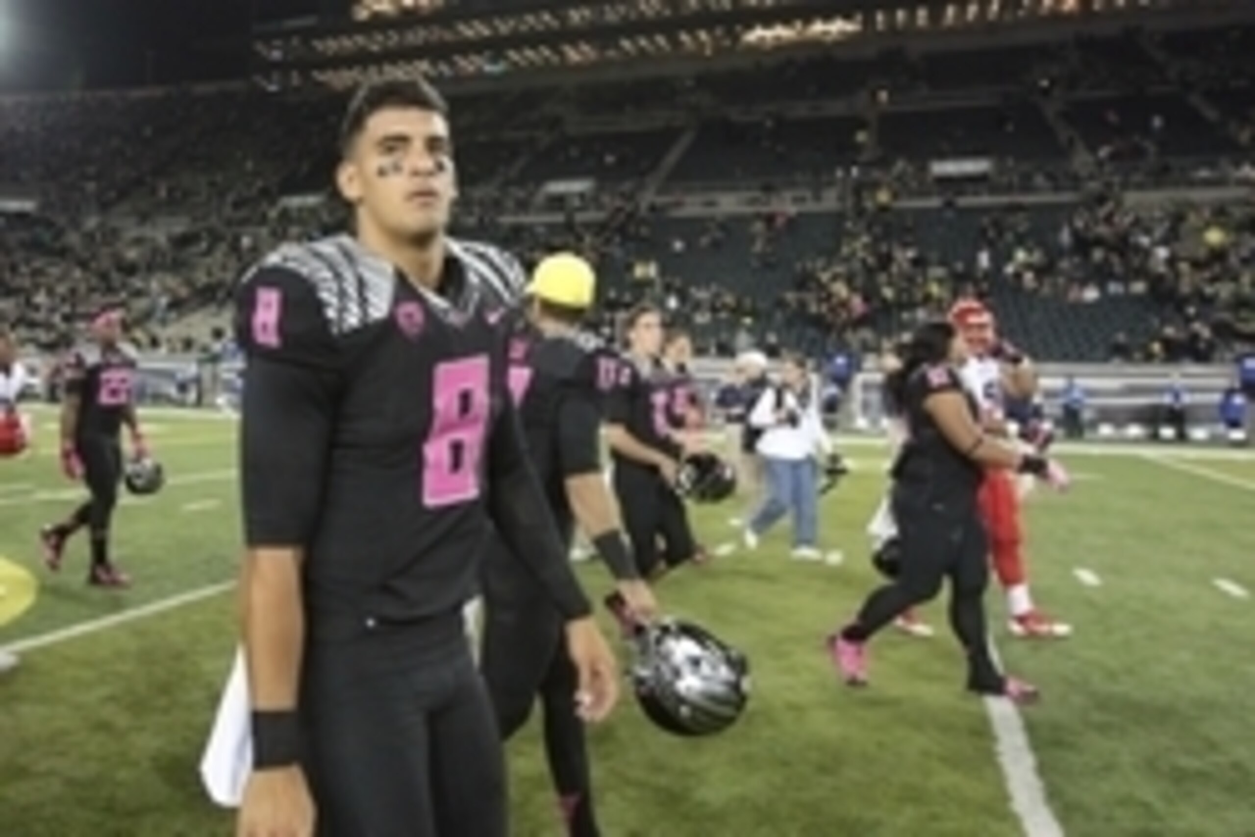 Oct 2, 2014; Eugene, OR, USA; Oregon Ducks quarterback Marcus Mariota (8) walks off the field after losing to the Arizona Wildcats 24-31 at Autzen Stadium. Mandatory Credit: Scott Olmos-USA TODAY Sports