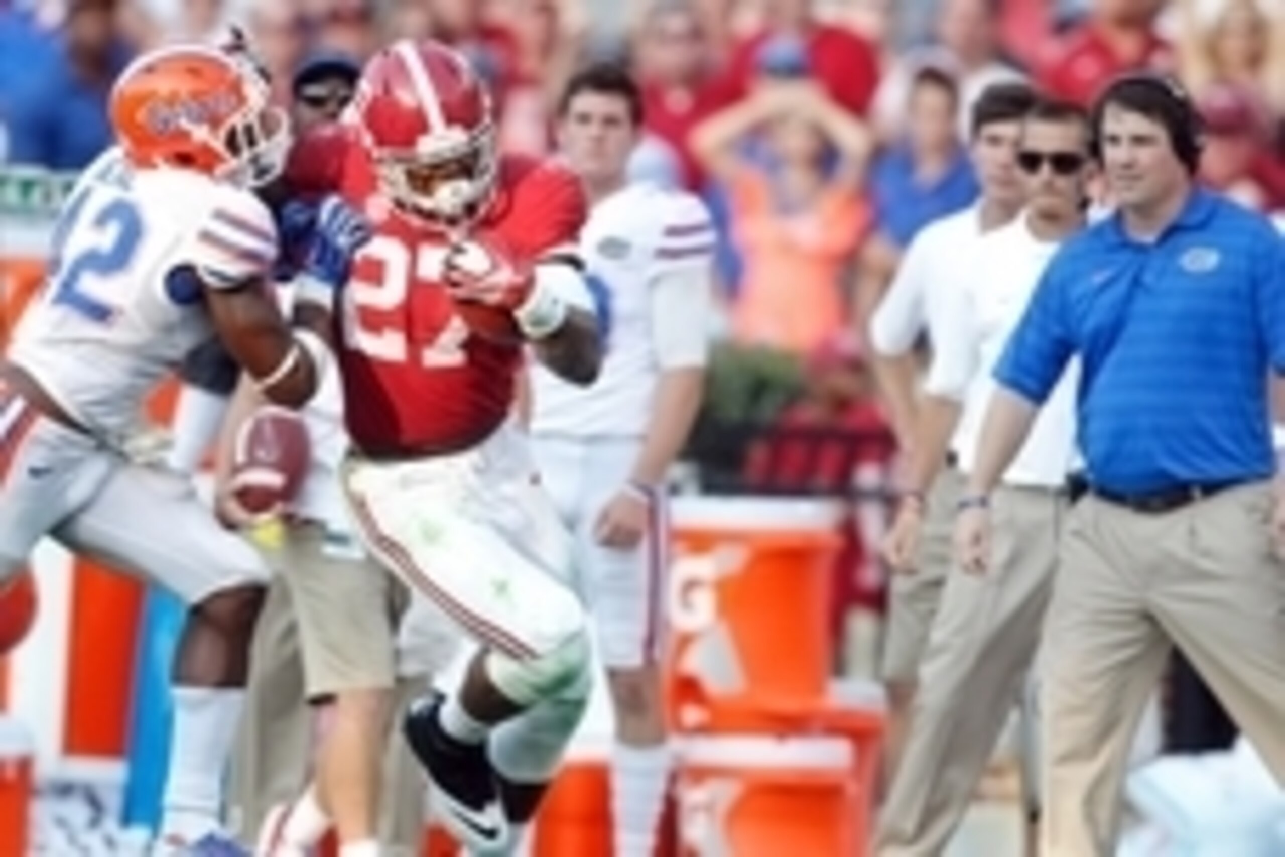 Sep 20, 2014; Tuscaloosa, AL, USA; Alabama Crimson Tide running back Derrick Henry (27) pushes away Florida Gators defensive back Keanu Neal (42) at Bryant-Denny Stadium. Mandatory Credit: Marvin Gentry-USA TODAY Sports