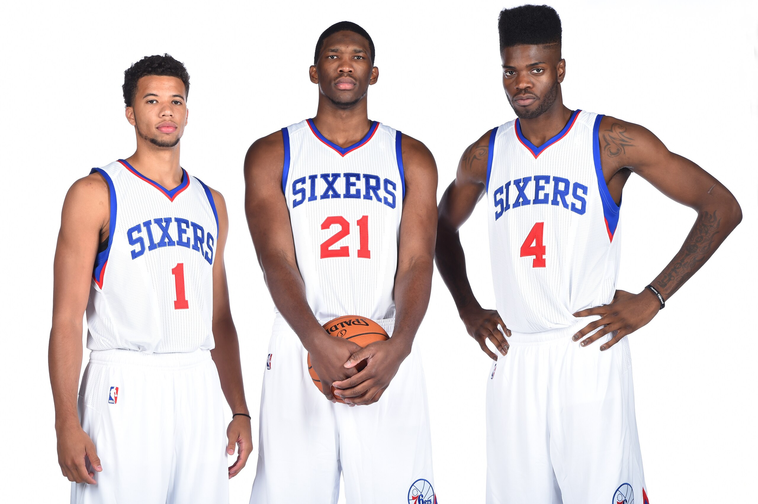 PHILADELPHIA, PA - SEPTEMBER 29: Michael Carter-Williams #1, Joel Embiid #21, and Nerlens Noel #4 of the Philadelphia 76ers during NBA Media Day on September 29, 2014 at Wells Fargo Center in Philadelphia, Pennsylvania. NOTE TO USER: User expressly ackno PHILADELPHIA, PA - SEPTEMBER 29: Michael Carter-Williams #1, Joel Embiid #21, and Nerlens Noel #4 of the Philadelphia 76ers during NBA Media Day on September 29, 2014 at Wells Fargo Center in Philadelphia, Pennsylvania. NOTE TO USER: User expressly ackno
