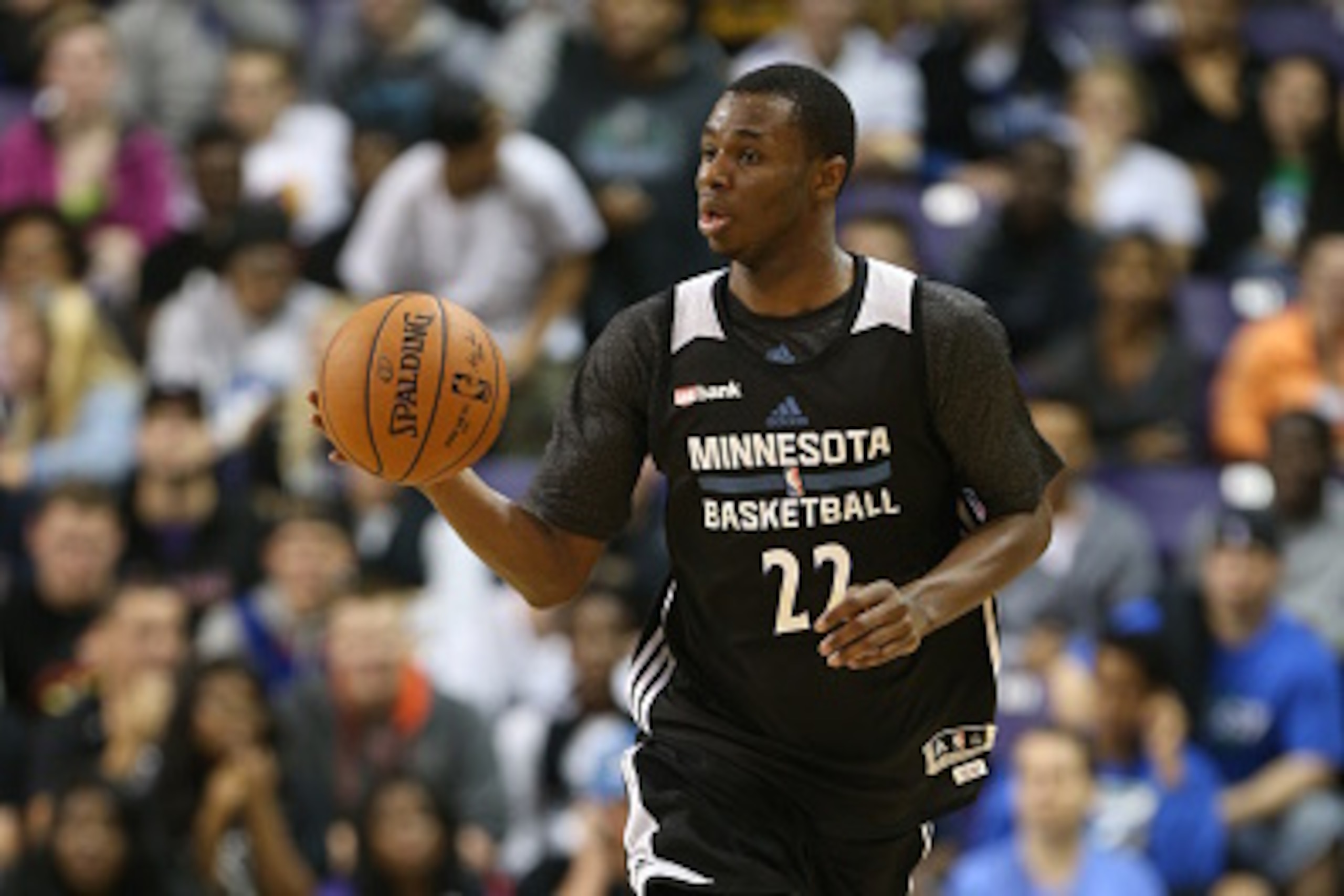 MANKATO, MN - SEPTEMBER 29:  Andrew Wiggins #22 of the Minnesota Timberwolves brings the ball up the court during a scrimmage at 2014 Training Camp opening event Dunks after Dark starting at midnight on September 29, 2014 at the Bresnan Arena Taylor Cente