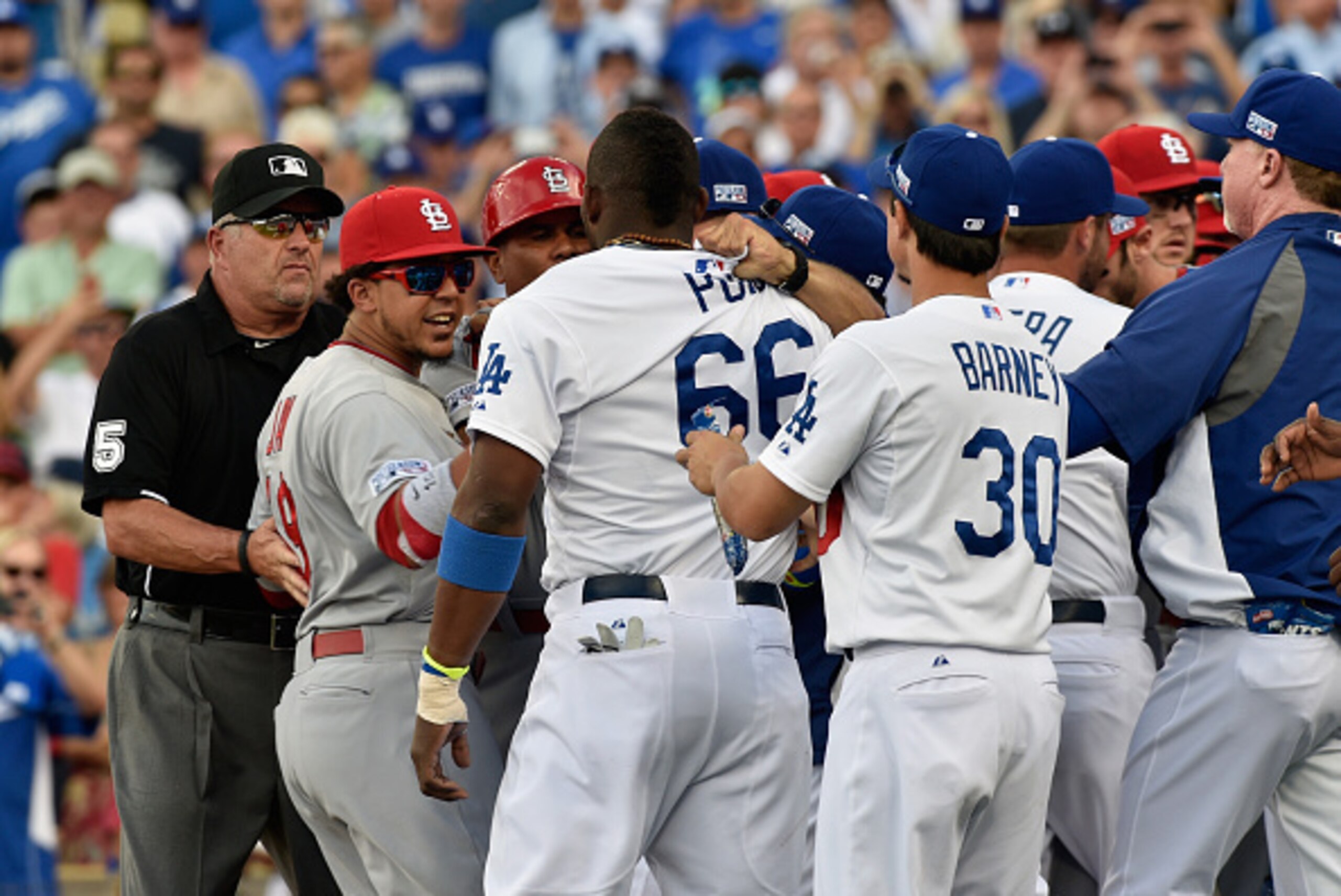 LOS ANGELES, CA - OCTOBER 03: Yasiel Puig #66 of the Los Angeles Dodgers exchanges words with the St. Louis Cardinals after being hit by a pitch in the third inning of Game One of the National League Division Series at Dodger Stadium on October 3, 2014 i LOS ANGELES, CA - OCTOBER 03: Yasiel Puig #66 of the Los Angeles Dodgers exchanges words with the St. Louis Cardinals after being hit by a pitch in the third inning of Game One of the National League Division Series at Dodger Stadium on October 3, 2014 i