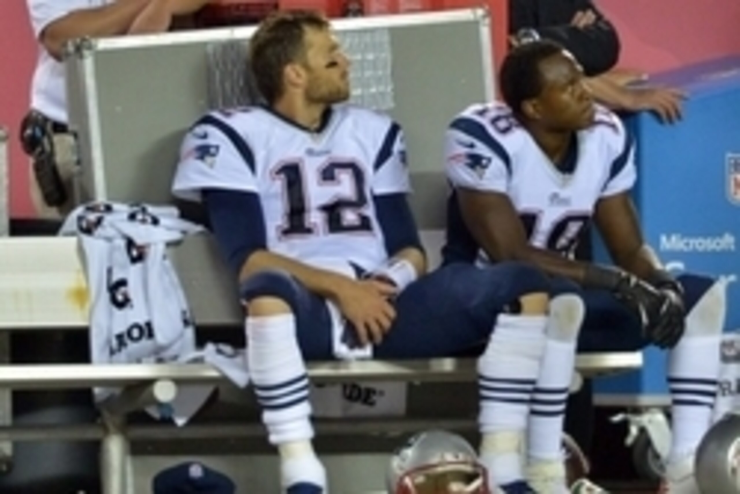 Sep 29, 2014; Kansas City, MO, USA; New England Patriots quarterback Tom Brady (12) and wide receiver Matthew Slater (18) watch the game on the sidelines during the second half against the Kansas City Chiefs at Arrowhead Stadium. The Chiefs won 41-14. Man