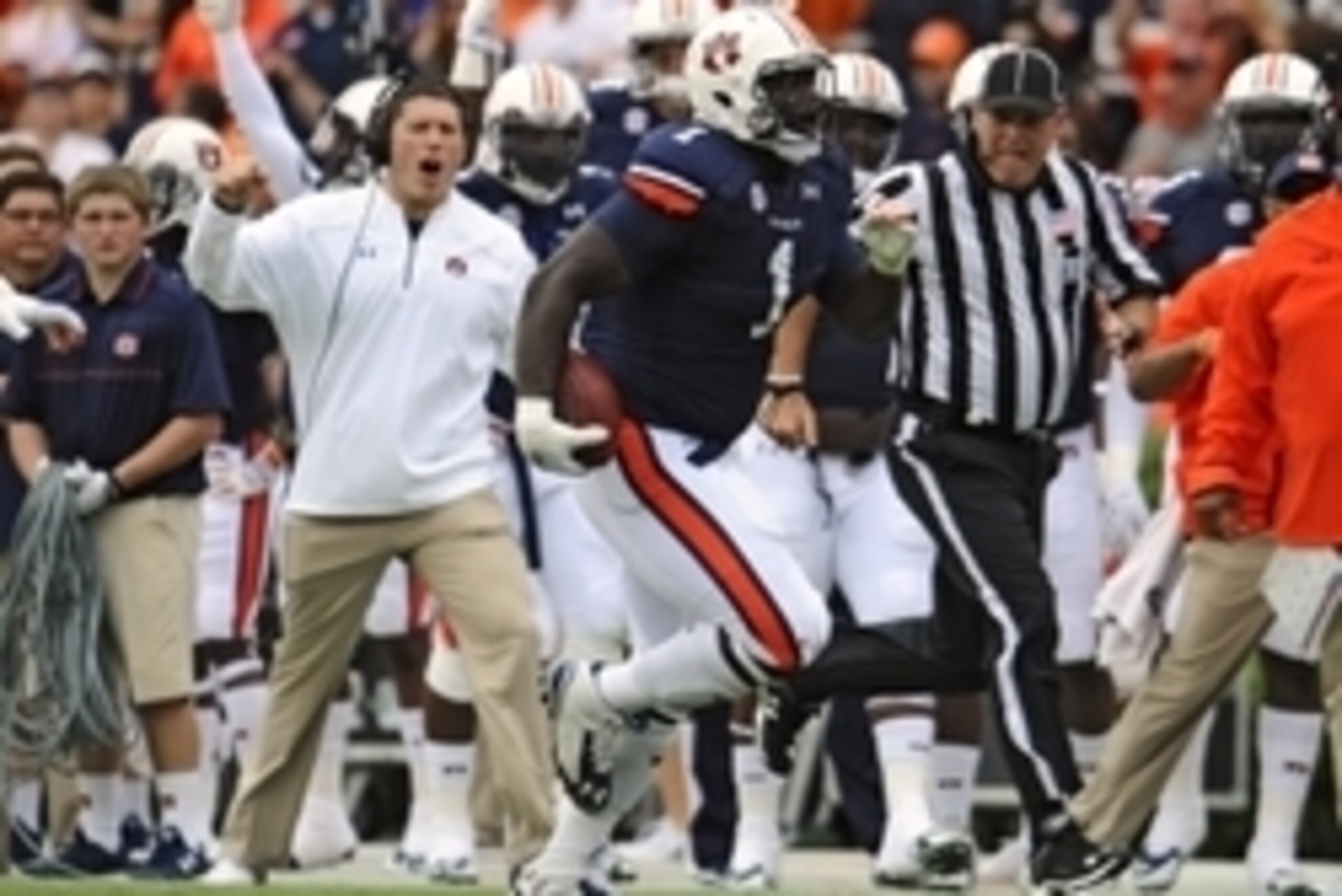 Sep 27, 2014; Auburn, AL, USA; Auburn Tigers defensive tackle Montravius Adams (1) runs the ball after an interception during the first half against the Louisiana Tech Bulldogs at Jordan Hare Stadium. Mandatory Credit: Shanna Lockwood-USA TODAY Sports