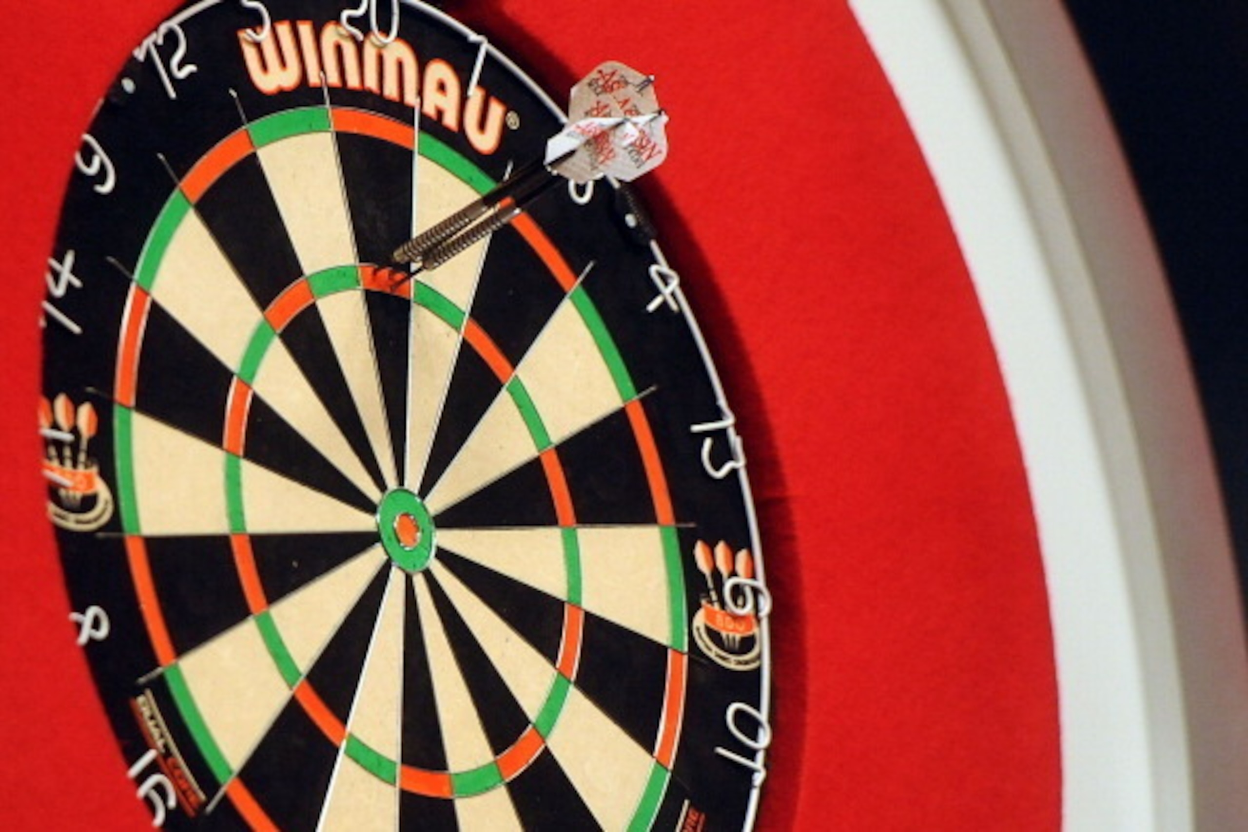 FRIMLEY, ENGLAND - JANUARY 04: The darts of Englands Martin Atkins in the board on day one of the BDO Lakeside World Professional Darts Championships at  Lakeside Complex on January 4, 2014 in Frimley, England. (Photo by Tom Dulat/Getty Images)