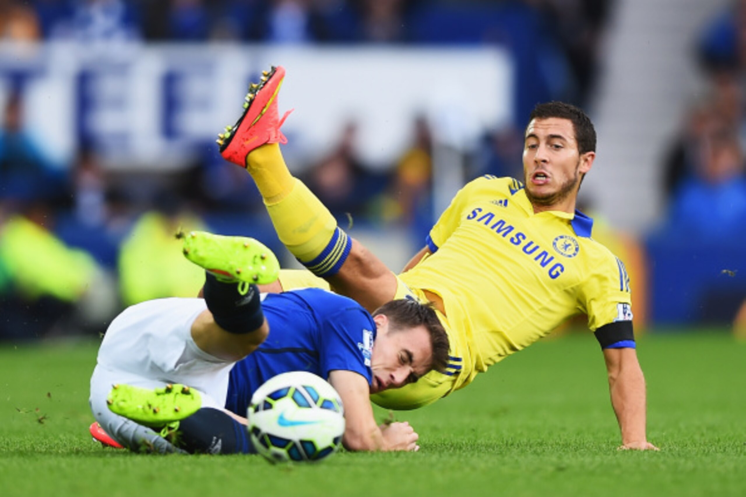 LIVERPOOL, ENGLAND - AUGUST 30:  Eden Hazard of Chelsea is tackled by Seamus Coleman of Everton during the Barclays Premier League match between Everton and Chelsea at Goodison Park on August 30, 2014 in Liverpool, England.  (Photo by Laurence Griffiths/G