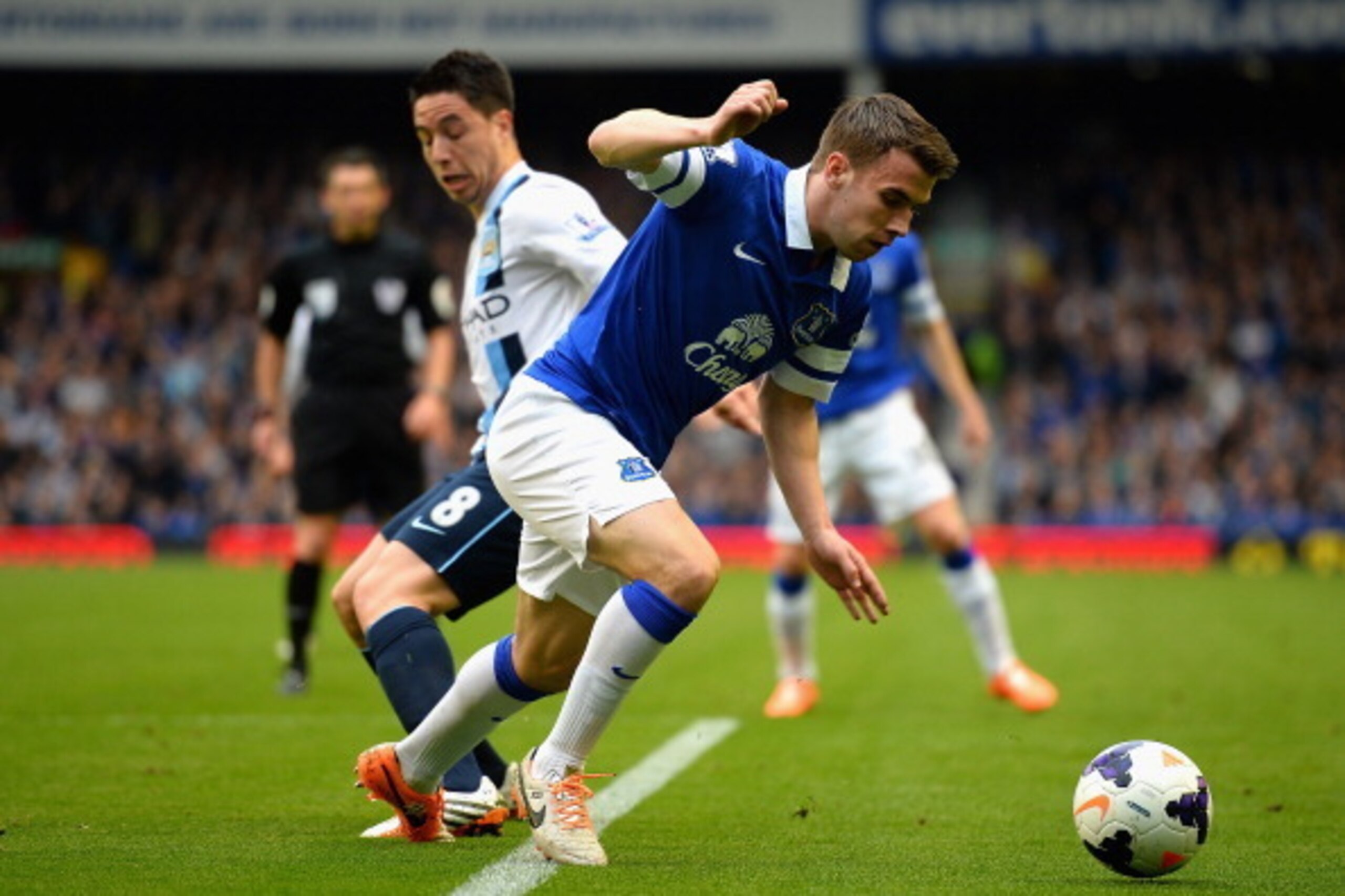 LIVERPOOL, ENGLAND - MAY 03:  Seamus Coleman of Everton competes with Samir Nasri of Manchester City during the Barclays Premier League match between Everton and Manchester City at Goodison Park on May 3, 2014 in Liverpool, England.  (Photo by Laurence Gr