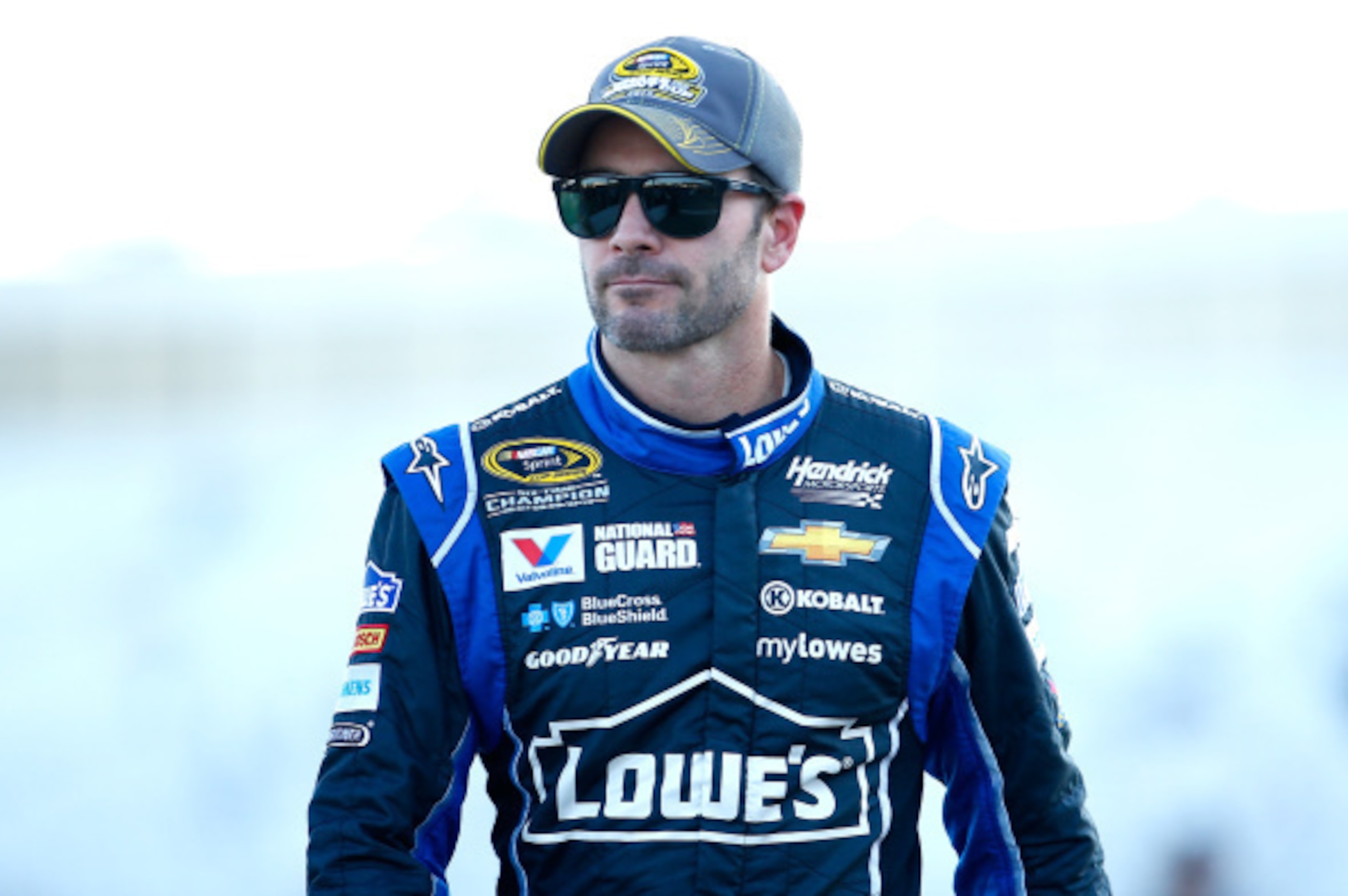 LOUDON, NH - SEPTEMBER 19:  Jimmie Johnson, driver of the #48 Lowe's Chevrolet, walks on pit road during qualifying for the NASCAR Sprint Cup Series Sylvania 300 at New Hampshire Motor Speedway on September 19, 2014 in Loudon, New Hampshire.  (Photo by Ja