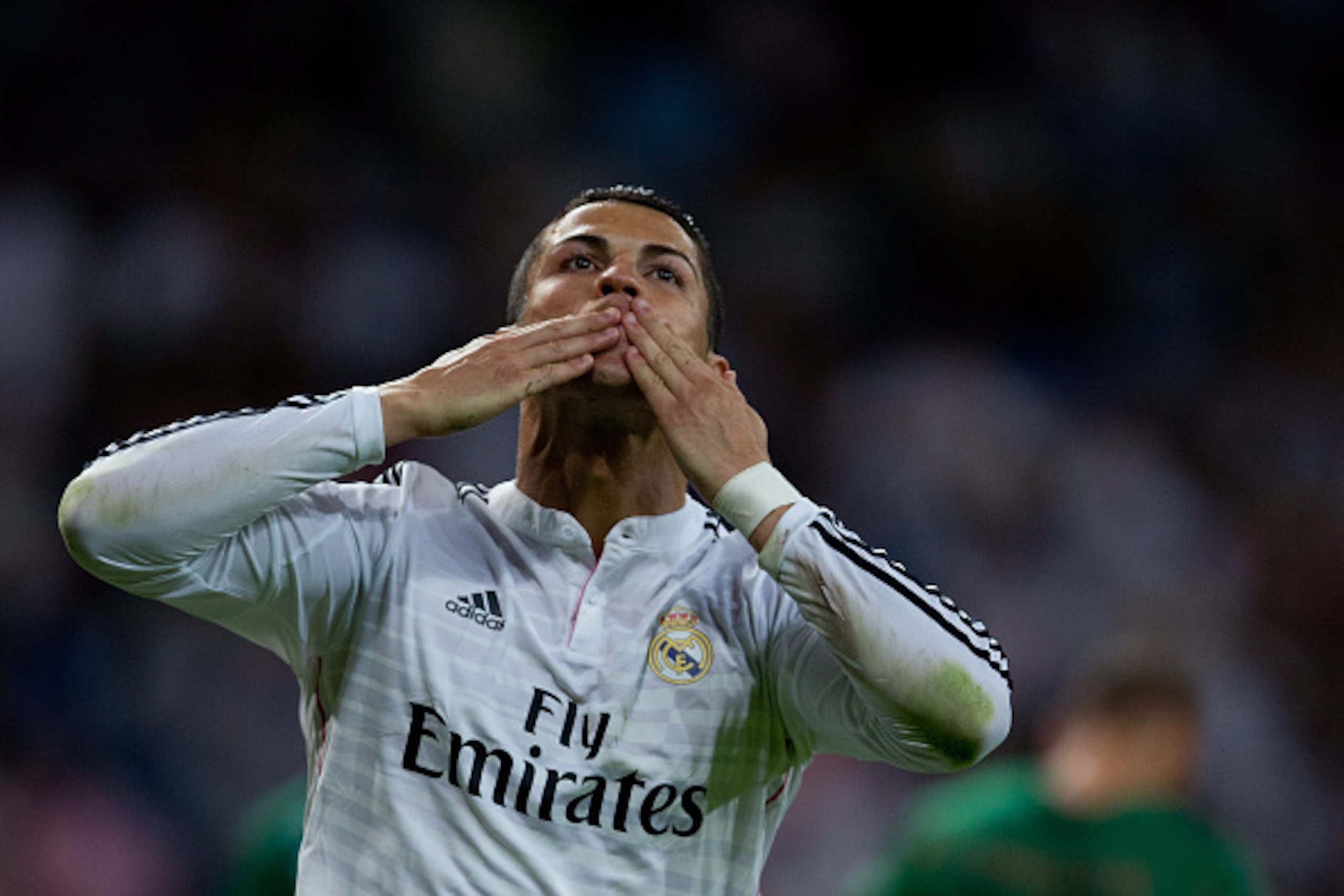 MADRID, SPAIN - SEPTEMBER 23:  Cristiano Ronaldo of Real Madrid CF celebrates scoring their fourth goal from a penalty shot during the La Liga match between Real Madrid CF and Elche CF at Estadio Santiago Bernabeu on September 23, 2014 in Madrid, Spain.  