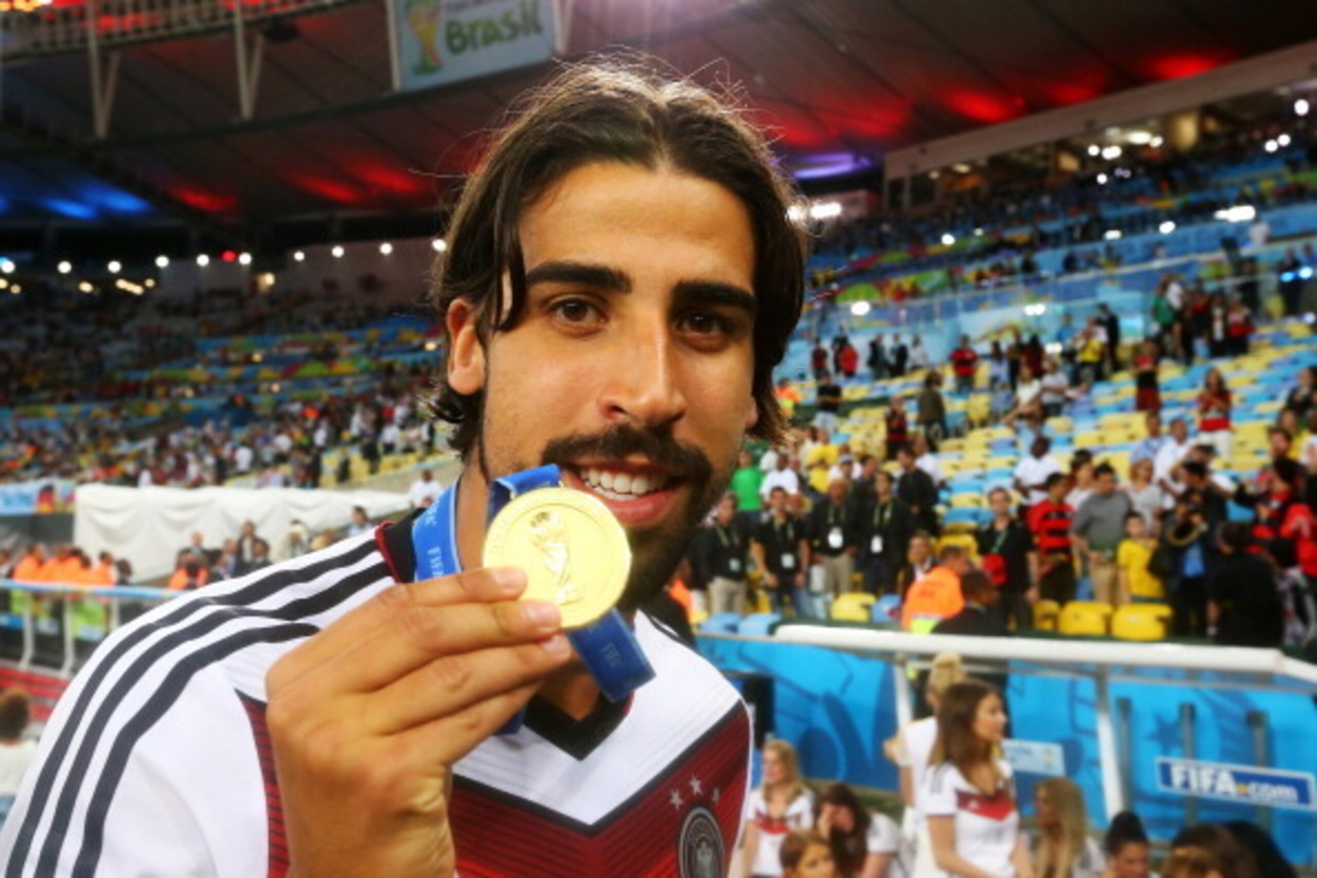 RIO DE JANEIRO, BRAZIL - JULY 13:  Sami Khedira of Germany celebrates with his medal after defeating Argentina 1-0 in extra-time during the 2014 FIFA World Cup Brazil Final match between Germany and Argentina at Maracana on July 13, 2014 in Rio de Janeiro