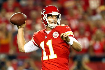 KANSAS CITY, MO - SEPTEMBER 29:   Alex Smith #11 of the Kansas City Chiefs passes against the New England Patriot during the first quarter at Arrowhead Stadium on September 29, 2014 in Kansas City, Missouri.  (Photo by Dilip Vishwanat/Getty Images)