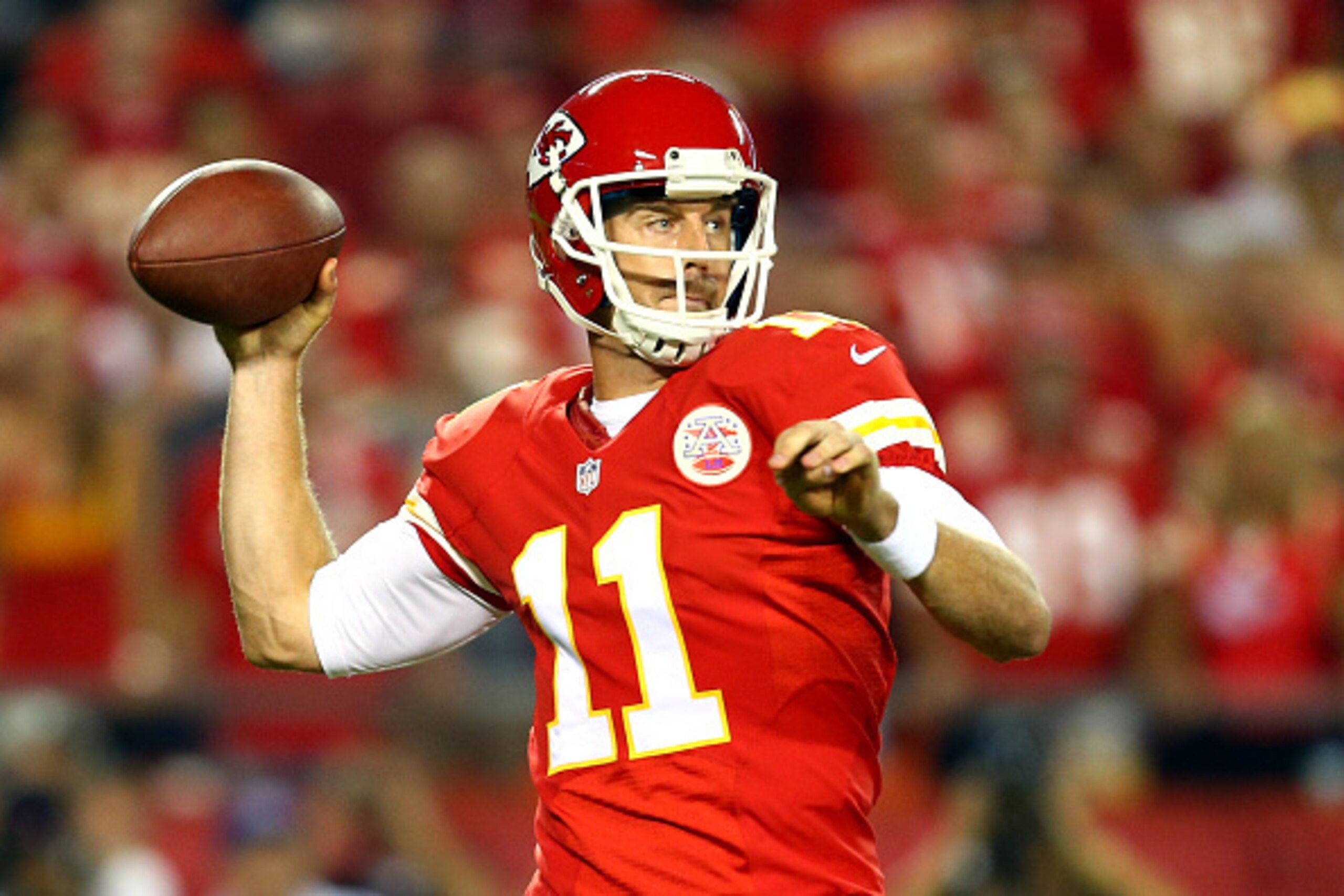 KANSAS CITY, MO - SEPTEMBER 29:   Alex Smith #11 of the Kansas City Chiefs passes against the New England Patriot during the first quarter at Arrowhead Stadium on September 29, 2014 in Kansas City, Missouri.  (Photo by Dilip Vishwanat/Getty Images)