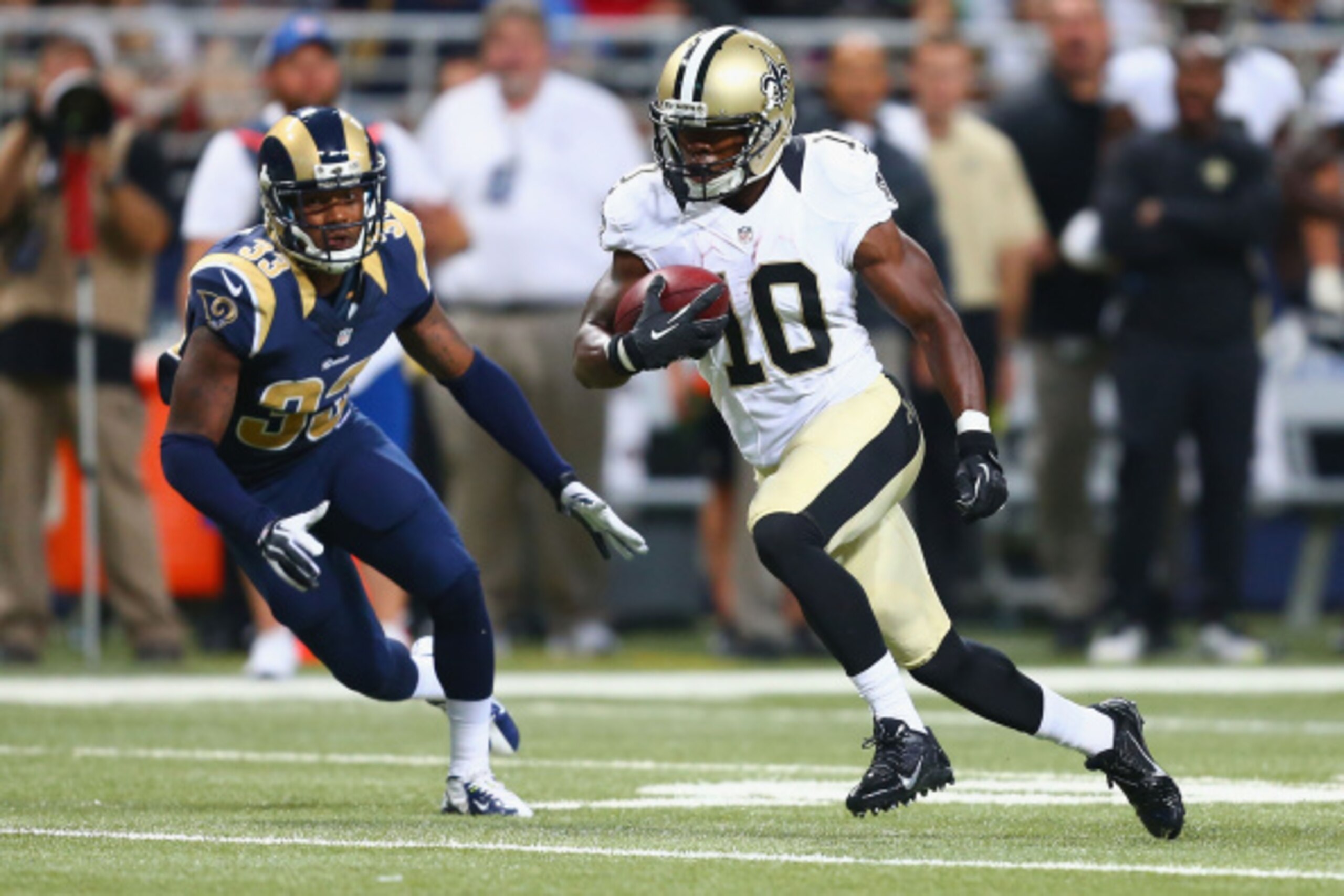 ST. LOUIS, MO - AUGUST 8: Brandin Cooks #10 of the New Orleans Saints runs upfield after making a catch against E.J. Gaines #33 of the St. Louis Rams during the second half of a pre-season game at the Edward Jones Dome on August 8, 2013 in St. Louis, Miss