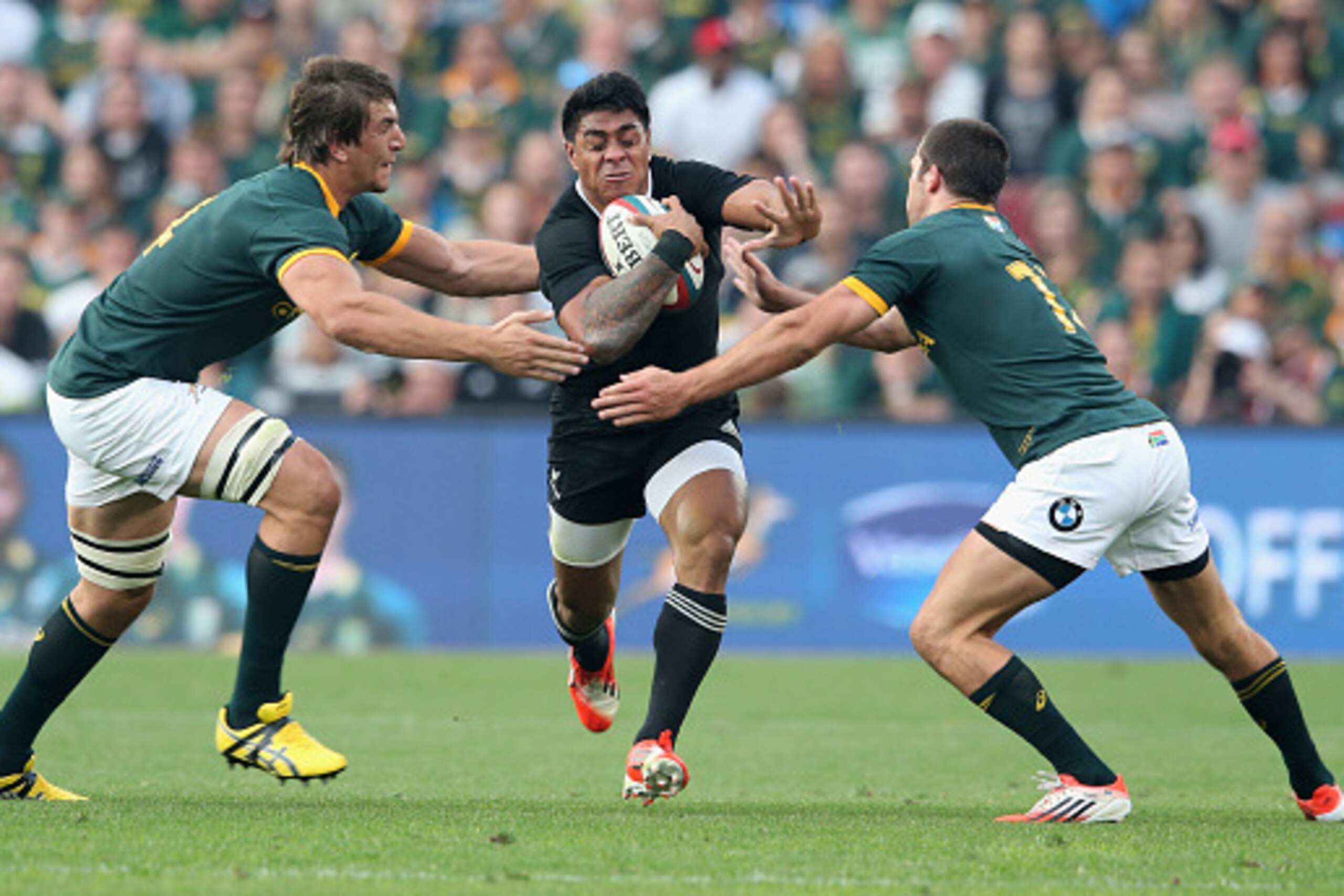 JOHANNESBURG, SOUTH AFRICA - OCTOBER 04:  Malakai Fekitoa of the All Blacks is tackled by Eben Etzebeth (L) and Jan Serfontein during the Rugby Championship match between the South African Springboks and the New Zealand All Blacks at Ellis Park Stadium on