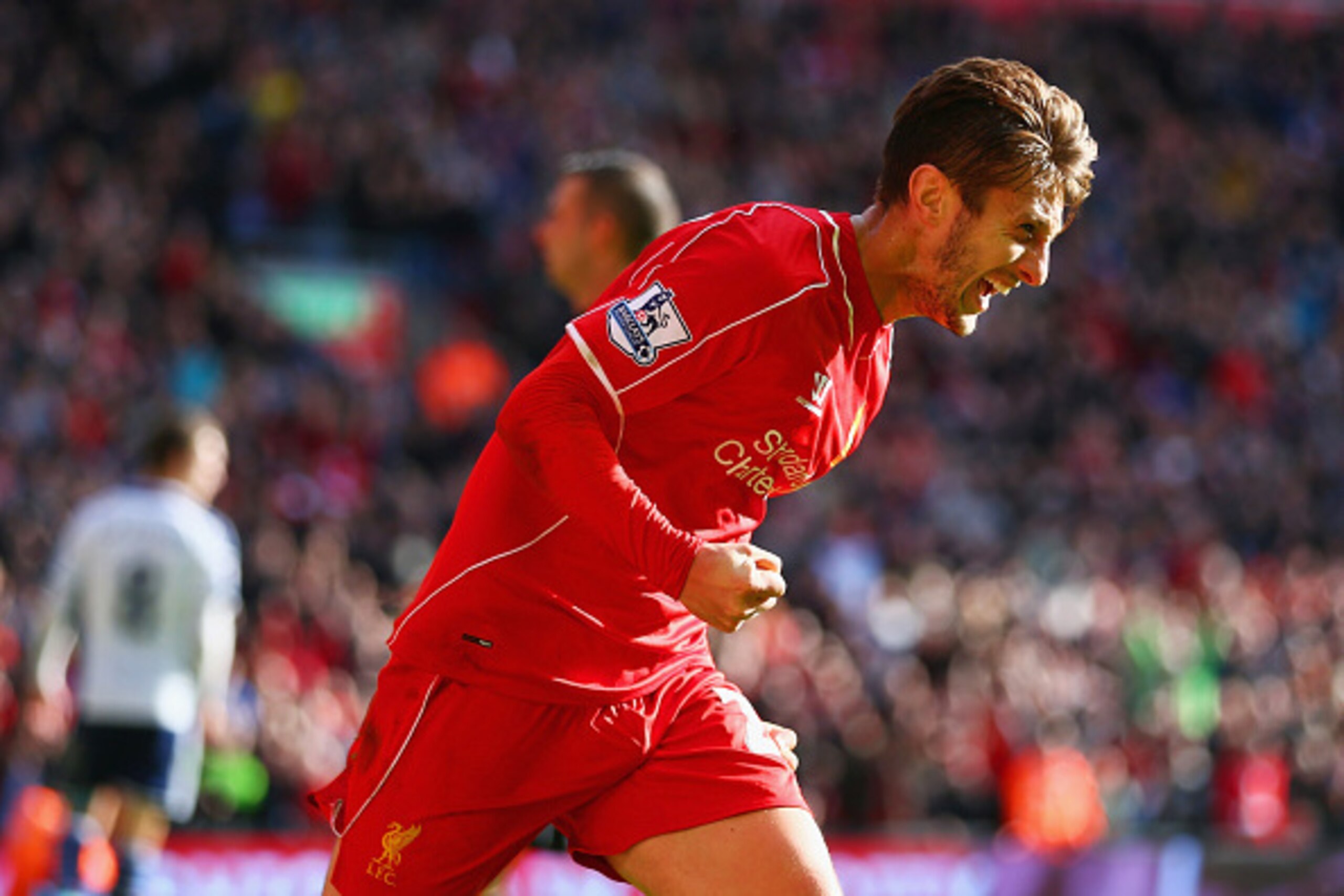 LIVERPOOL, ENGLAND - OCTOBER 04:  Adam Lallana of Liverpool celebrates scoring the opening goal during the Barclays Premier League match between Liverpool and West Bromwich Albion at Anfield on October 4, 2014 in Liverpool, England.  (Photo by Clive Bruns