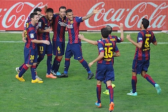 MADRID, SPAIN - OCTOBER 04:  Neymar (#11) of FC Barcelona celebrates with teammates after scoring his team's 2nd goal during the La Liga match between Rayo Vallecano de Madrid and FC Barcelona at Estadio Teresa Rivero on October 4, 2014 in Madrid, Spain. 