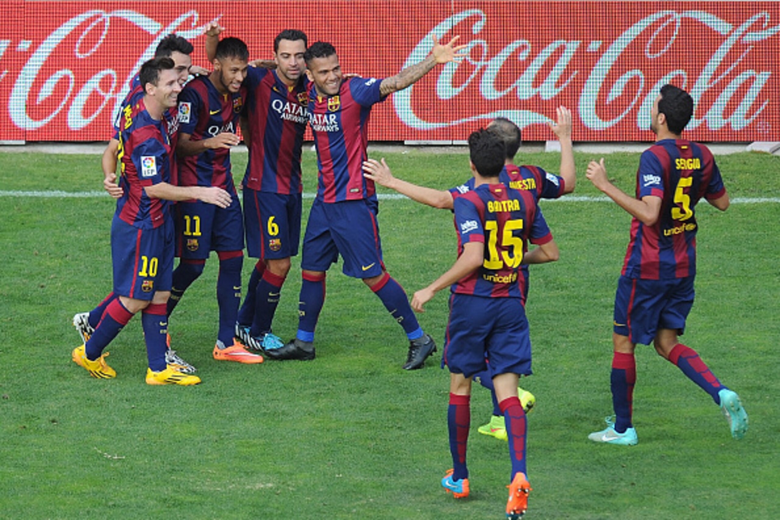 MADRID, SPAIN - OCTOBER 04:  Neymar (#11) of FC Barcelona celebrates with teammates after scoring his team's 2nd goal during the La Liga match between Rayo Vallecano de Madrid and FC Barcelona at Estadio Teresa Rivero on October 4, 2014 in Madrid, Spain. 