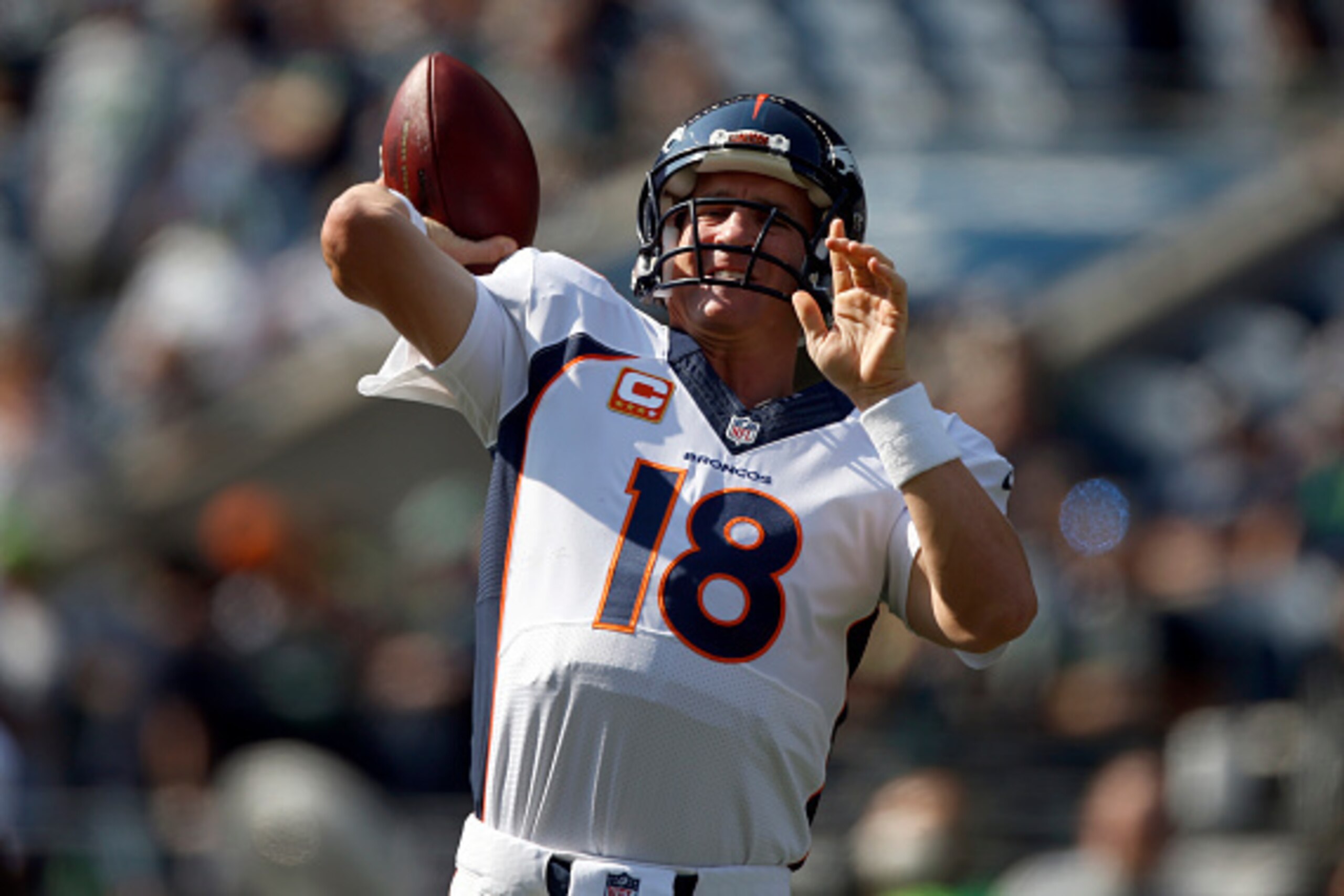 SEATTLE, WA - SEPTEMBER 21: Quarterback Peyton Manning #18 of the Denver Broncos warms up before the game against the Seattle Seahawks at CenturyLink Field on September 21, 2014 in Seattle,Washington. (Photo by Otto Greule Jr/Getty Images)