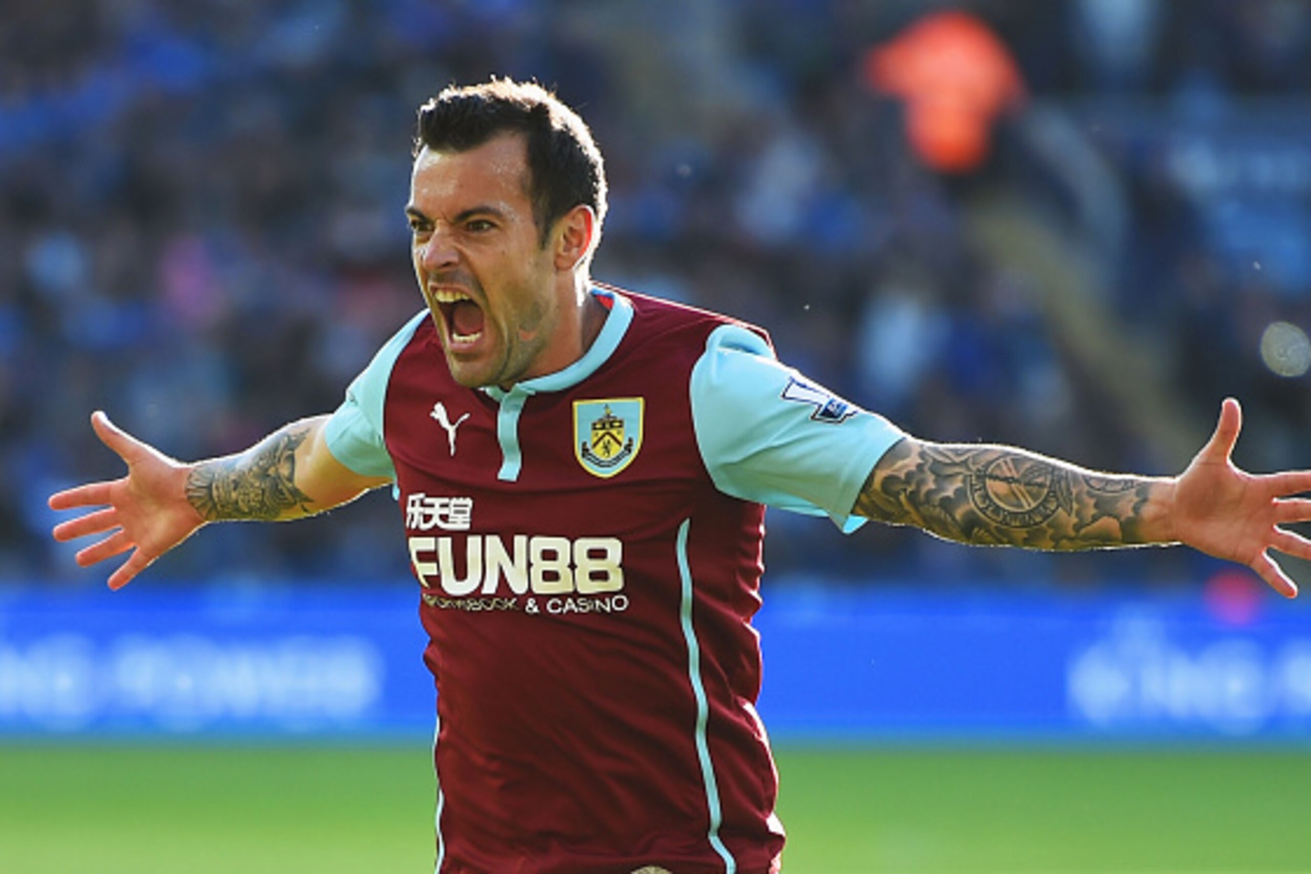 LEICESTER, ENGLAND - OCTOBER 04:  Ross Wallace of Burnley celebrates as he scores their second and equalising goal during the Barclays Premier League match between Leicester City and Burnley at The King Power Stadium on October 4, 2014 in Leicester, Engla