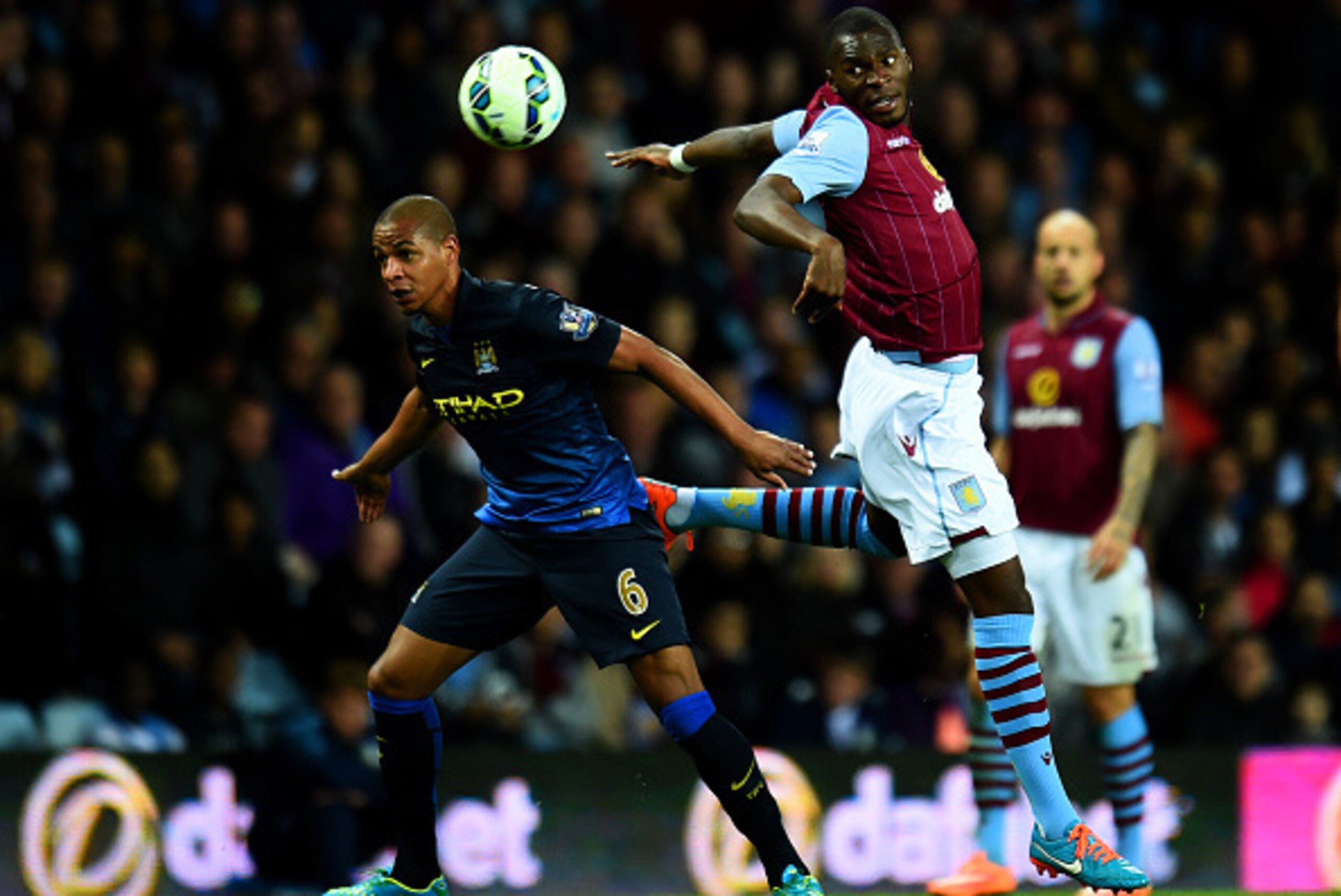 BIRMINGHAM, ENGLAND - OCTOBER 04:  Christian Benteke of Aston Villa battles for the ball with Fernando of Manchester City during the Barclays Premier League match between Aston Villa and Manchester City at Villa Park on October 4, 2014 in Birmingham, Engl