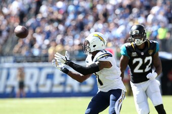 SAN DIEGO, CA - SEPTEMBER 28:  Wide receiver Eddie Royal #11 of the San Diego Chargers makes the catch before carrying the ball for a score on a 43 yard touchdown pass play in the second quarter past safety Winston Guy Jr. #22 of the Jacksonville Jaguars 
