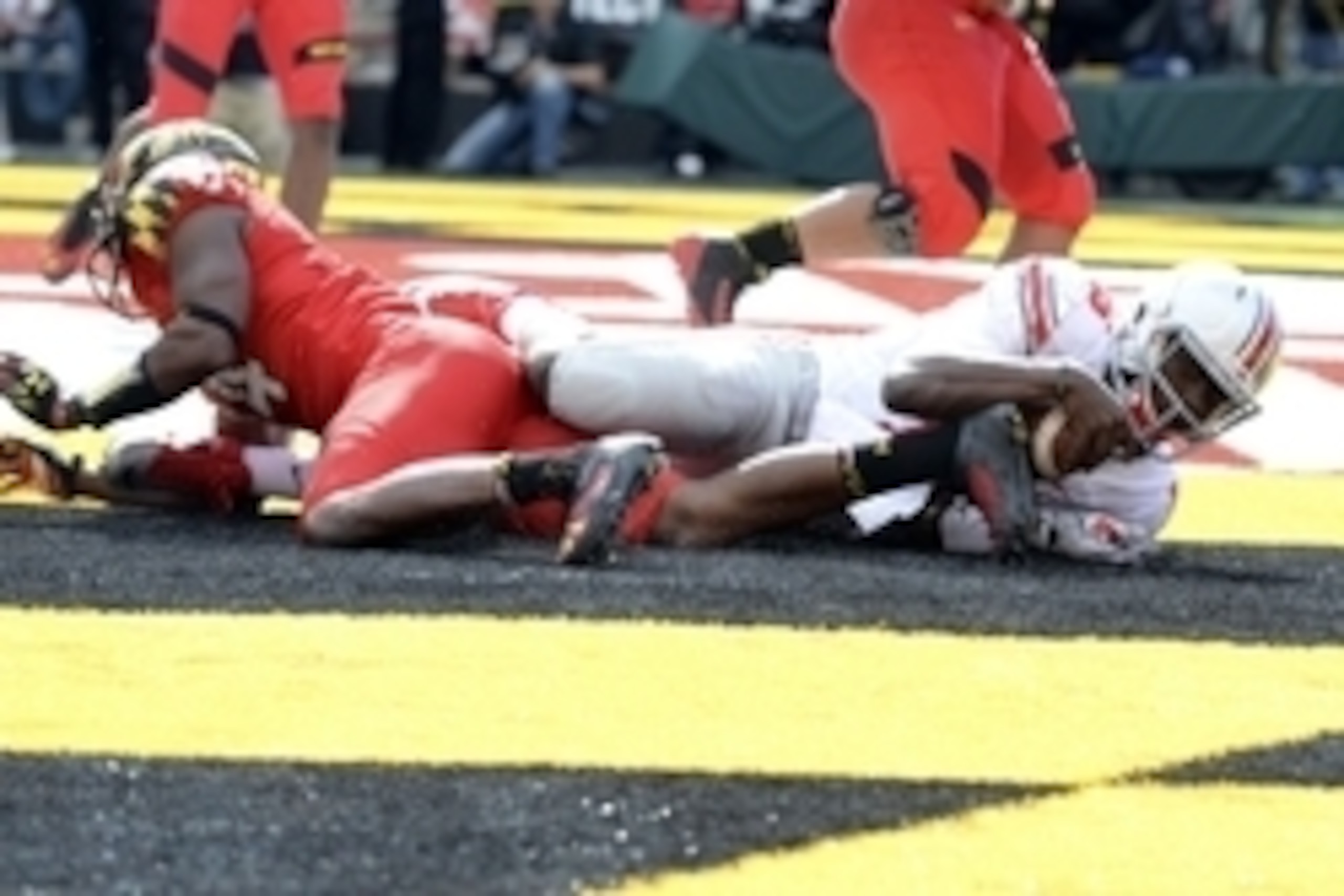 Oct 4, 2014; College Park, MD, USA; Ohio State Buckeyes quarterback J.T. Barrett (16) dives into the end zone for a touchdown during the fourth quarter against the Maryland Terrapins at Byrd Stadium. Ohio State Buckeyes defeated Maryland Terrapins 52-24. 