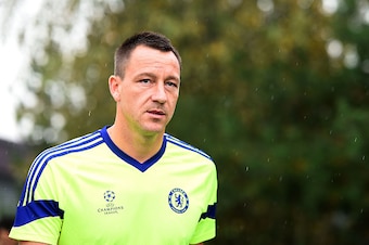 COBHAM, ENGLAND - SEPTEMBER 29:  John Terry walks out onto the pitch during the Chelsea Training Session at Chelsea Training Ground on September 29, 2014 in Cobham, England.  (Photo by Christopher Lee/Getty Images)