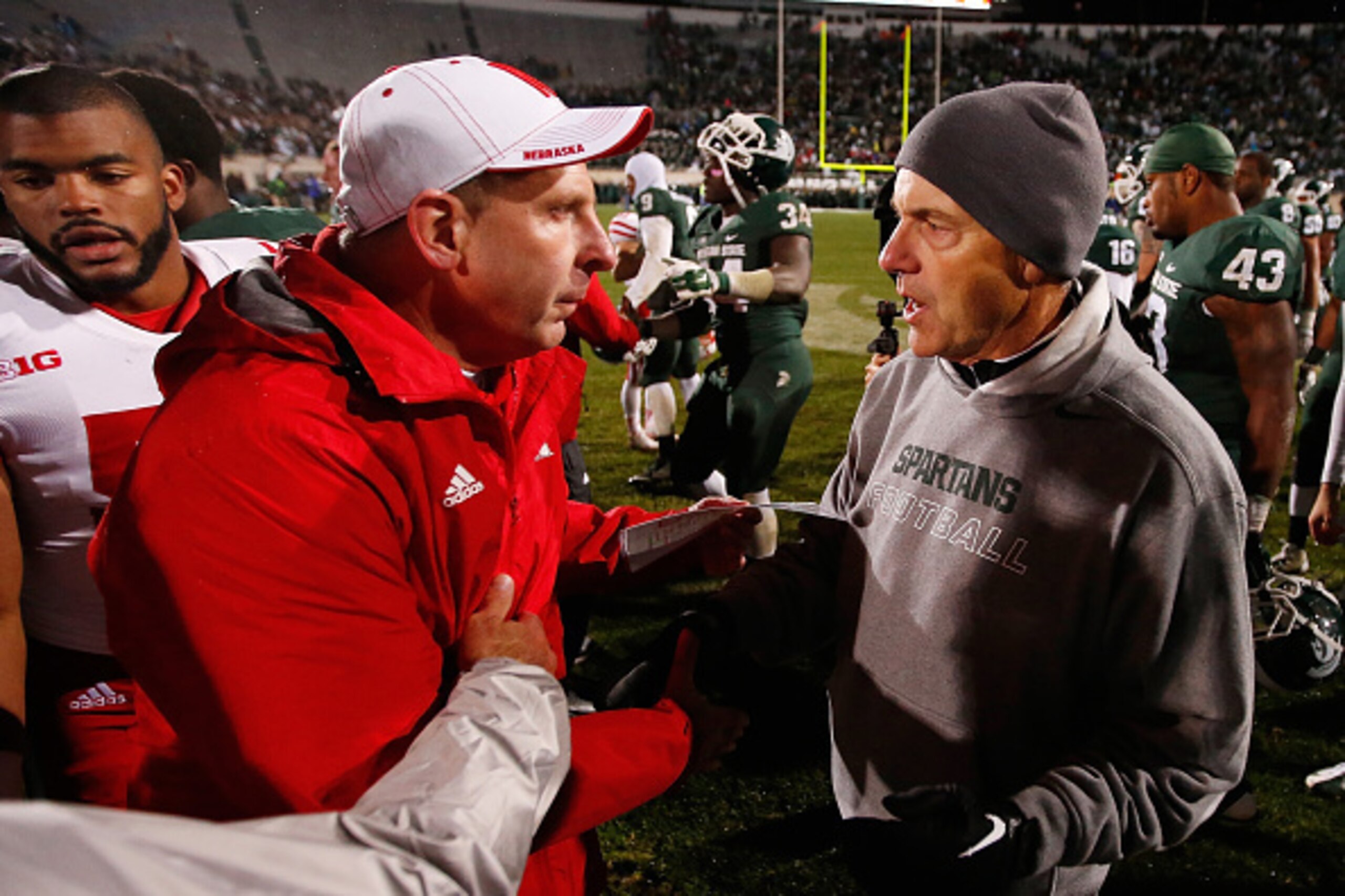 EAST LANSING, MI - OCTOBER 04: Head coach Mark Dantonio of the Michigan State Spartans shakes hands with head coach Bo Pelini after a 27-22 win at Spartan Stadium on October 4, 2014 in East Lansing, Michigan. (Photo by Gregory Shamus/Getty Images)