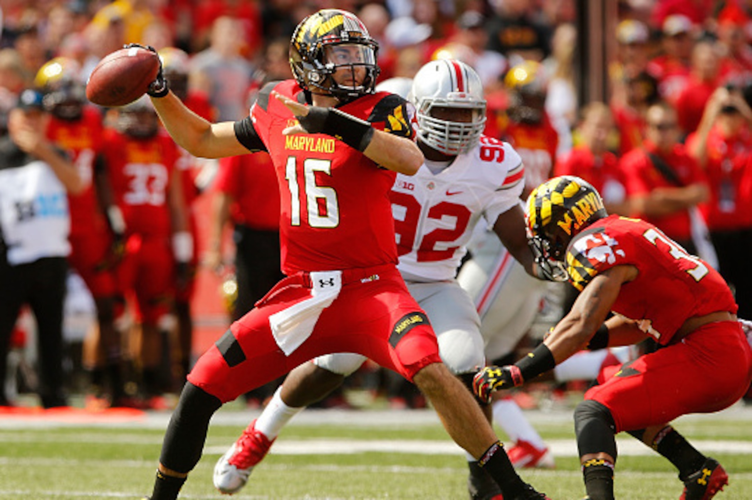 COLLEGE PARK, MD - OCTOBER 04:  Quarterback C.J. Brown #16 of the Maryland Terrapins makes a throw against the Ohio State Buckeyes defense in the first half at Byrd Stadium on October 4, 2014 in College Park, Maryland.  (Photo by Jonathan Ernst/Getty Imag