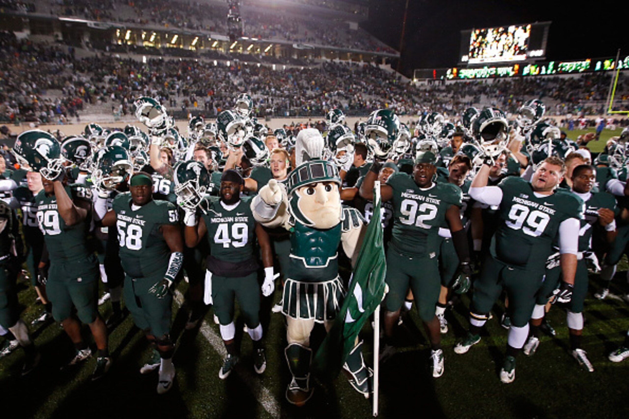 EAST LANSING, MI - OCTOBER 04:  The Michigan State Spartans celebrate a 27-22 win over the Nebraska Cornhuskers at Spartan Stadium on October 4, 2014 in East Lansing, Michigan. (Photo by Gregory Shamus/Getty Images)