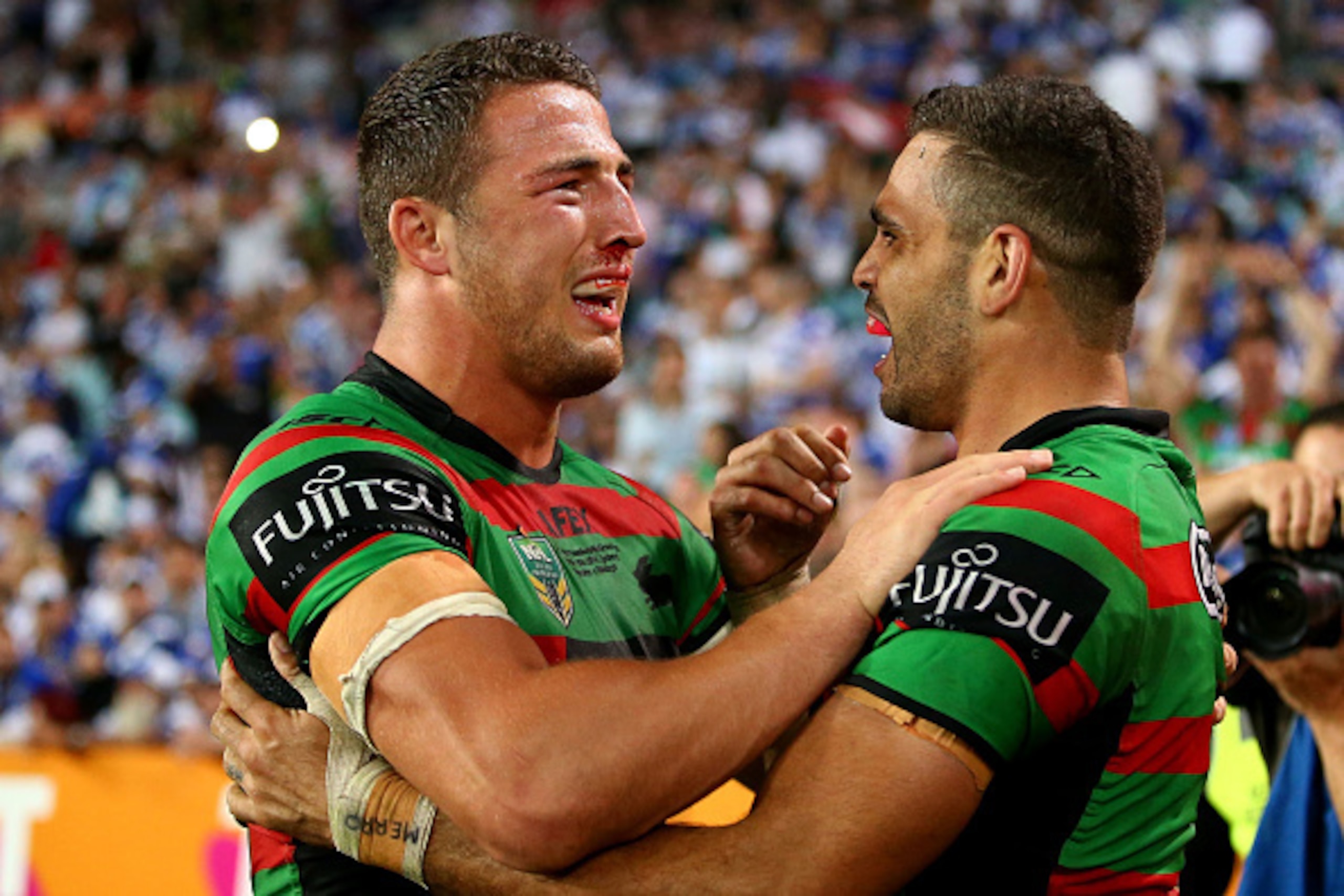 SYDNEY, AUSTRALIA - OCTOBER 05:  Sam Burgess and Greg Inglis of the Rabbitohs show their emotion after winning the 2014 NRL Grand Final match between the South Sydney Rabbitohs and the Canterbury Bulldogs at ANZ Stadium on October 5, 2014 in Sydney, Austr