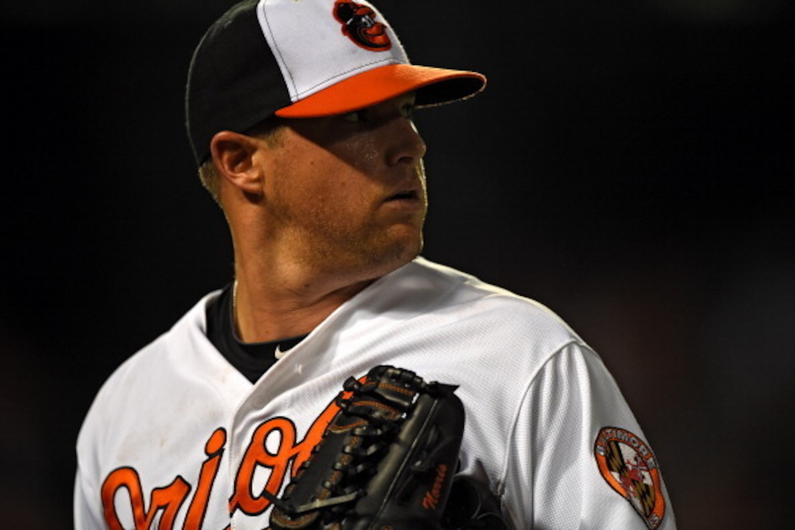 BALTIMORE, MD - MAY 12: Pitcher Bud Norris #25 of the Baltimore Orioles walks to the dugout in the eighth inning after hitting Torii Hunter #48 of the Detroit Tigers at Oriole Park at Camden Yards on May 12, 2014 in Baltimore, Maryland. The Detroit Tigers