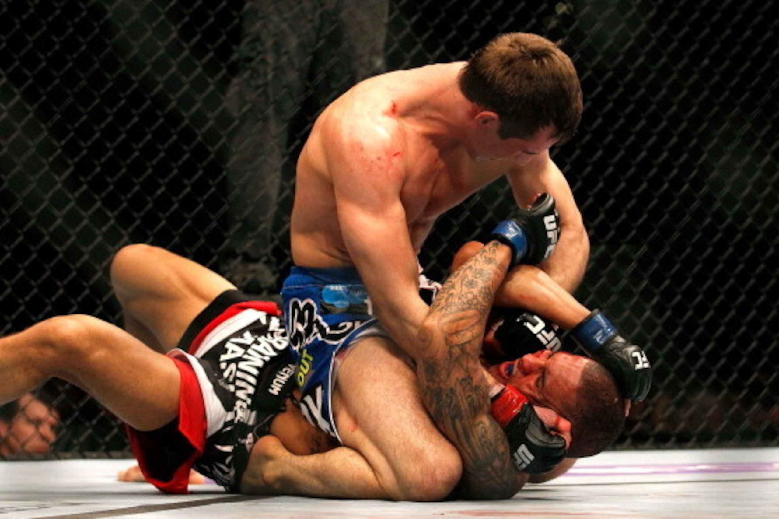 ATLANTA, GA - APRIL 21:  Rory MacDonald (top) punches Che Mills during their welterweight bout for UFC 145 at Philips Arena on April 21, 2012 in Atlanta, Georgia.  (Photo by Kevin C. Cox/Getty Images)