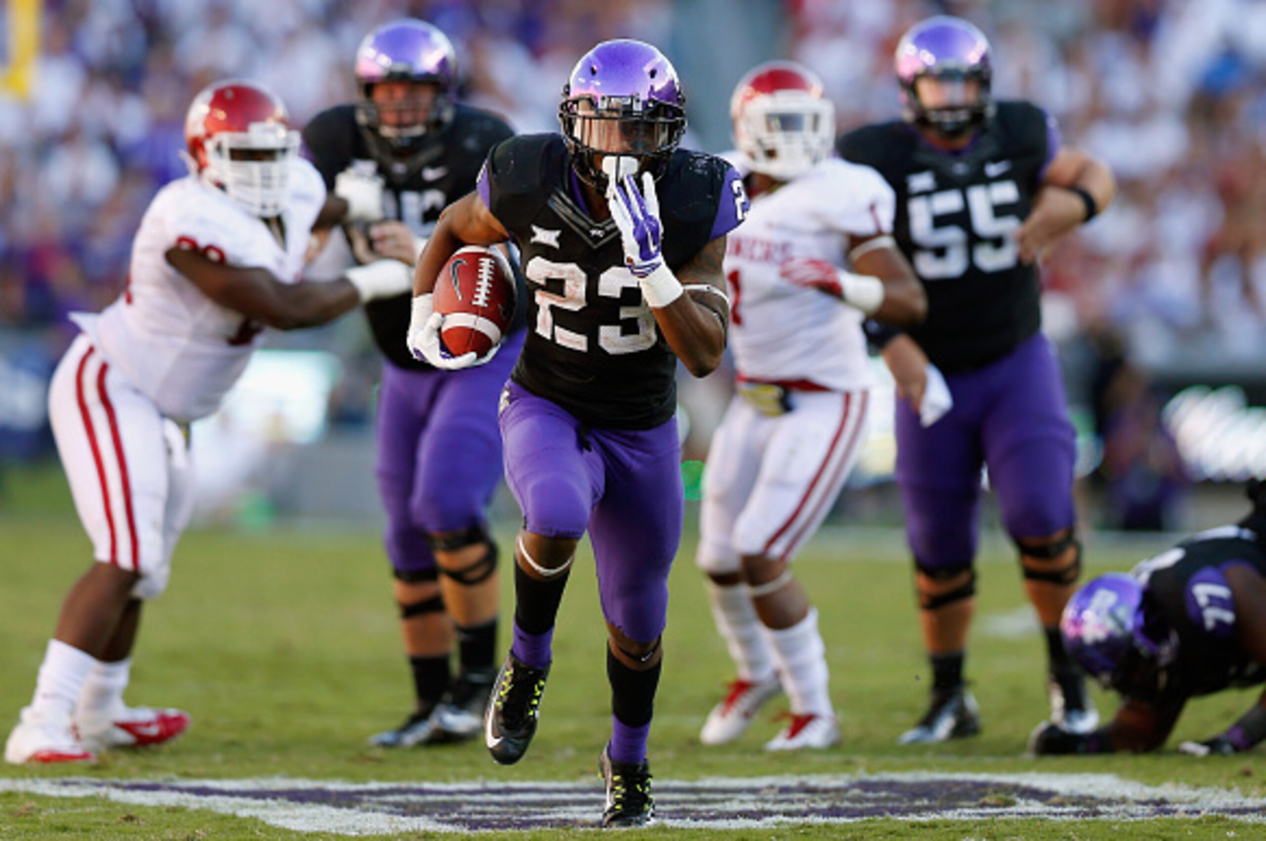 FORT WORTH, TX - OCTOBER 04:  Running back B.J. Catalon #23 of the TCU Horned Frogs carries the ball against the Oklahoma Sooners in the second half at Amon G. Carter Stadium on October 4, 2014 in Fort Worth, Texas.  (Photo by Tom Pennington/Getty Images)