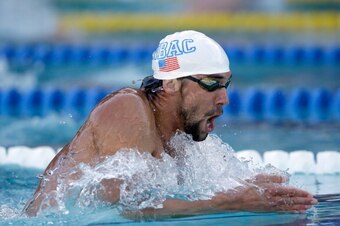 SANTA CLARA, CA - JUNE 22:  Michael Phelps swims the breaststroke in the men's 200 meter IM final during the 2014 Arena Grand Prix of Santa Clara at the George F. Haines International Swim Center on June 22, 2014 in Santa Clara, California.  (Photo by Ezr