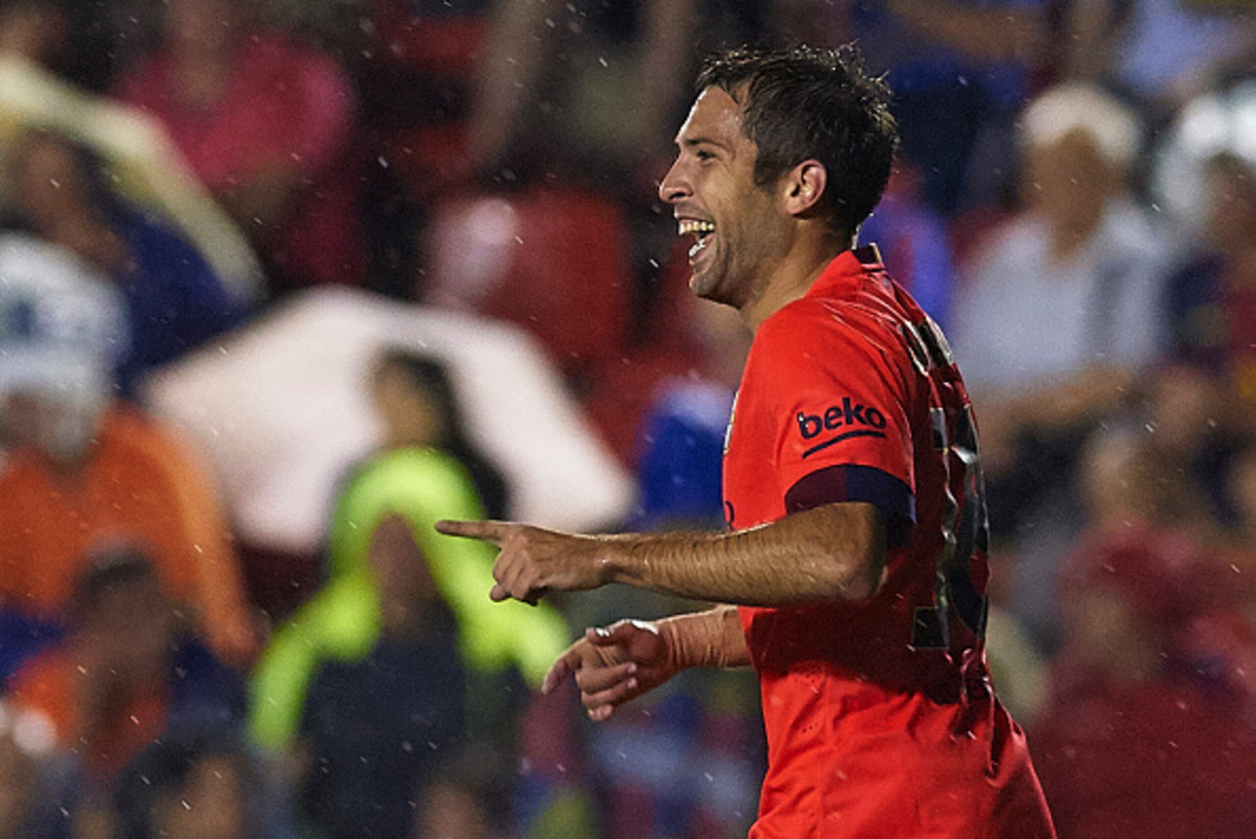 VALENCIA, SPAIN - SEPTEMBER 21: Jordi Alba of Barcelona celebrates after scoring during the La Liga match between Levante UD and FC Barcelona at Ciutat de Valencia on September 21, 2014 in Valencia, Spain.  (Photo by Manuel Queimadelos Alonso/Getty Images