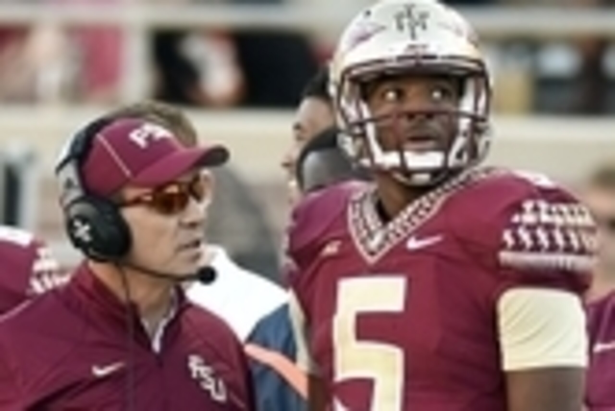Oct 4, 2014; Tallahassee, FL, USA; Florida State Seminoles head coach Jimbo Fisher talks with quarterback Jameis Winston (5) during the fourth quarter against the Wake Forest Demon Deacons at Doak Campbell Stadium. Florida State Seminoles defeated the Wak
